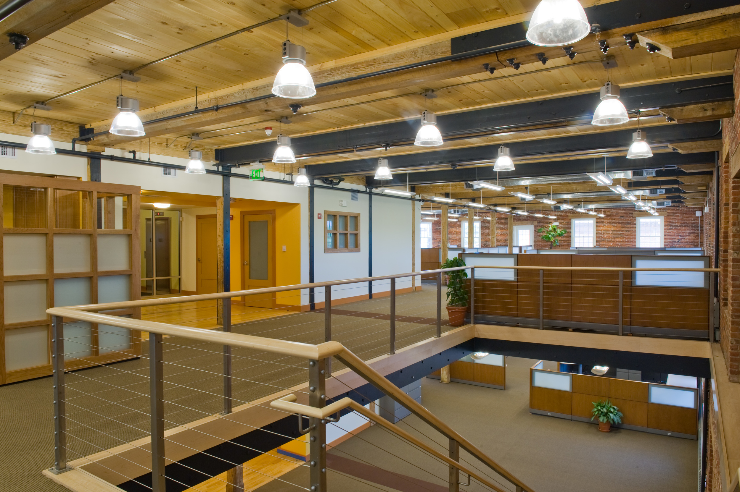 "UK Architects provided excellent design services from concept to completion for our office space. We are particularly delighted with the way UK Architects handled the balance between showcasing the historical character of the existing brick, beams and wood ceiling with the contemporary aspects and infrastructure of our information technology office. They also handled the task of working with various owners, consultants and engineers to deliver the project seamlessly, actually exceeding out expectations."