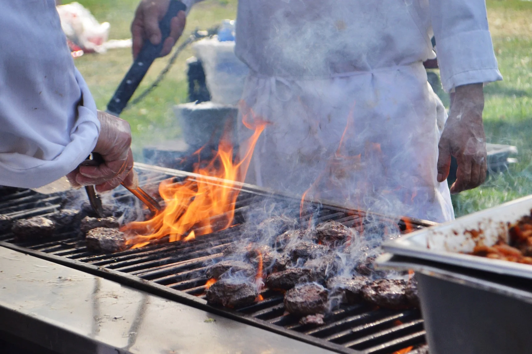 Cookin up burgers in the Budweiser and Burgers tent