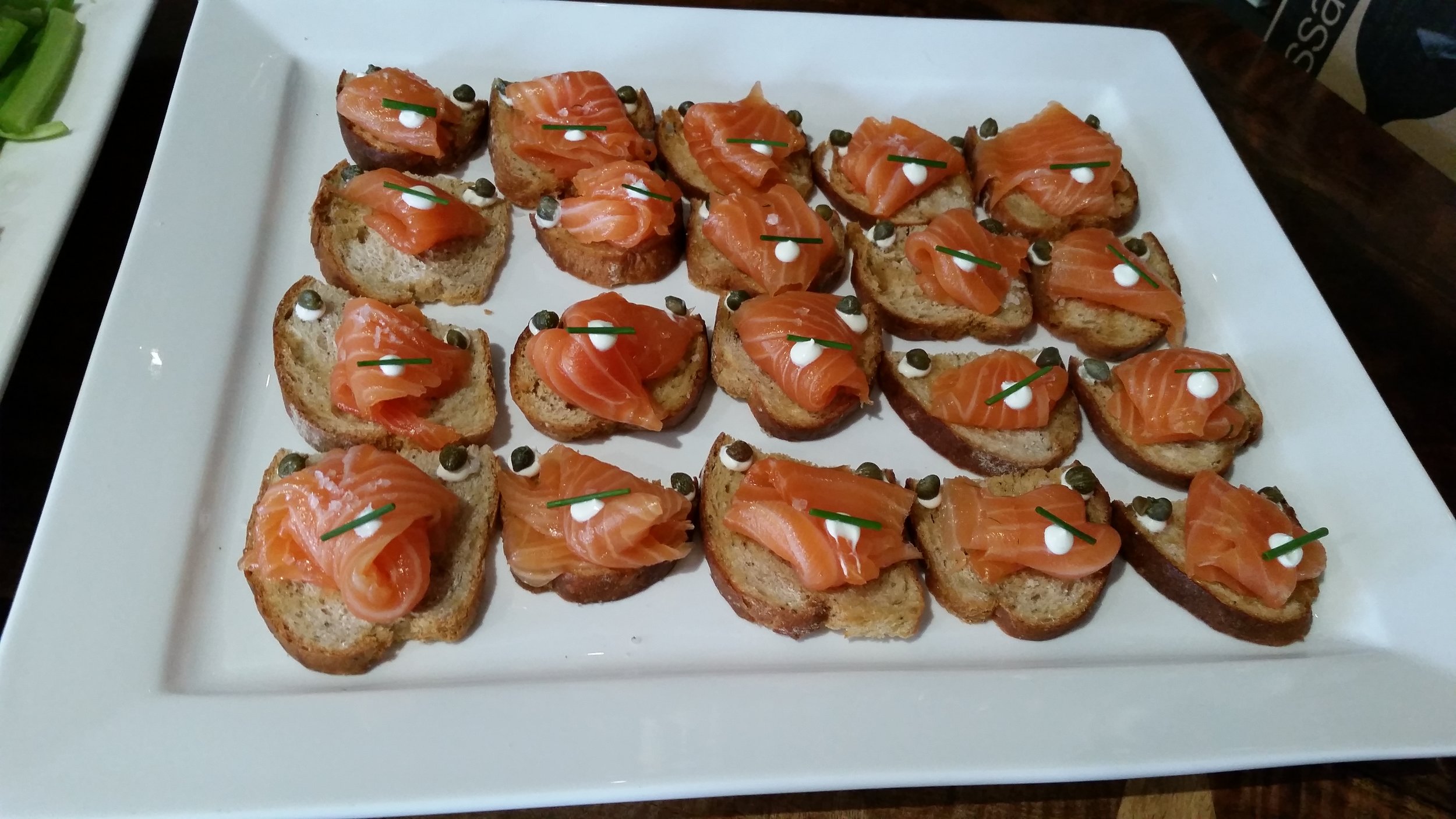 Cured salmon crostinis- Rye, Crème Fraiche, Capers, smoked roe.jpg