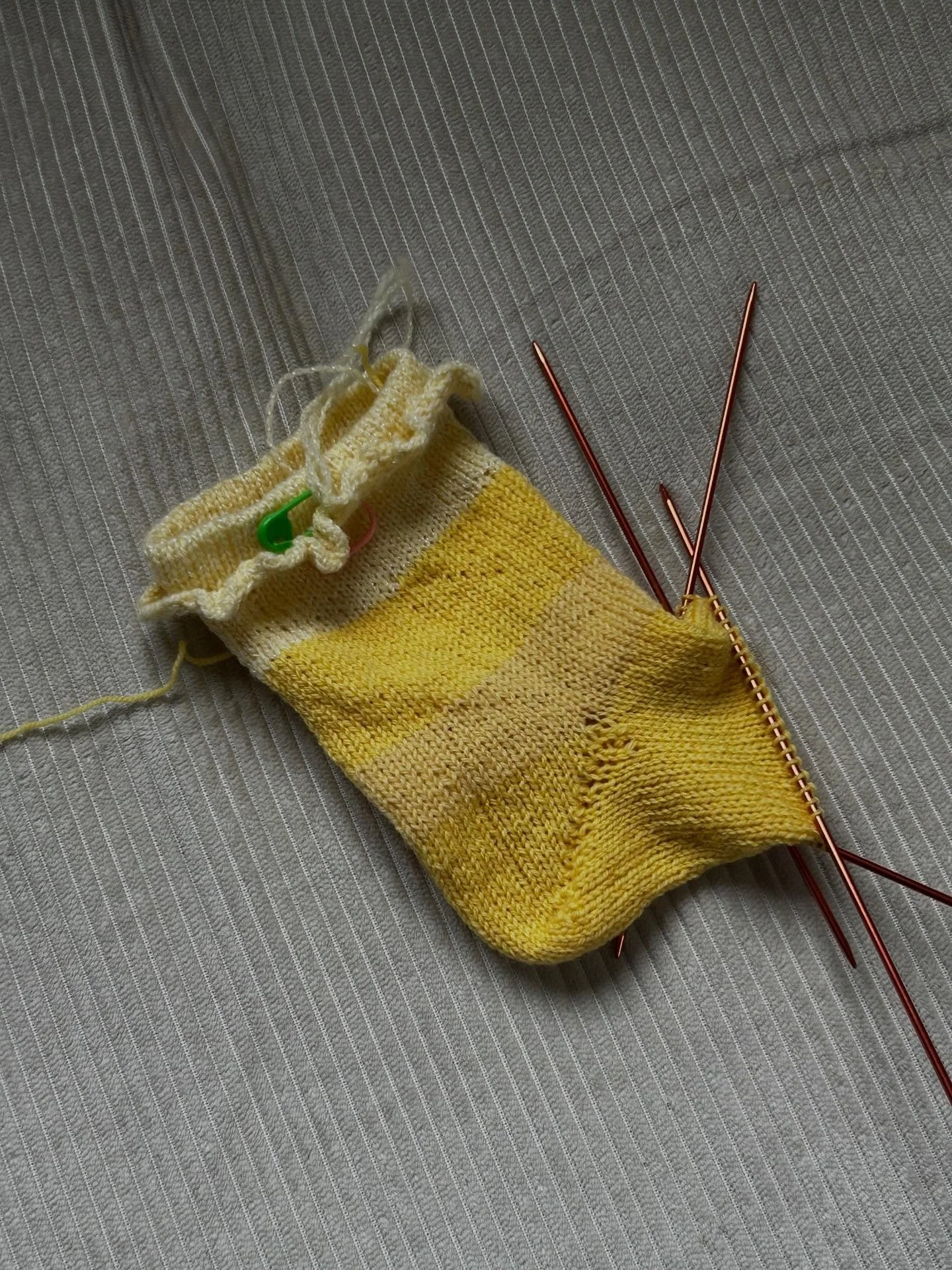 My first pair of socks ✨✨✨and my first time using double pointed needles.

I knitted these Ruffle Socks on planes, in the park, on my family&rsquo;s couches across the country, and learned that socks are the perfect travel knitting project. I also le