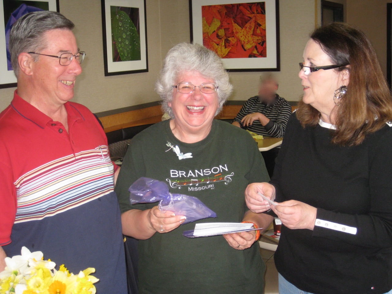 Dennis and Susan Oldacre were very excited to receive the tickets for Frontier Airlines from JA member Sheryl Schiller.