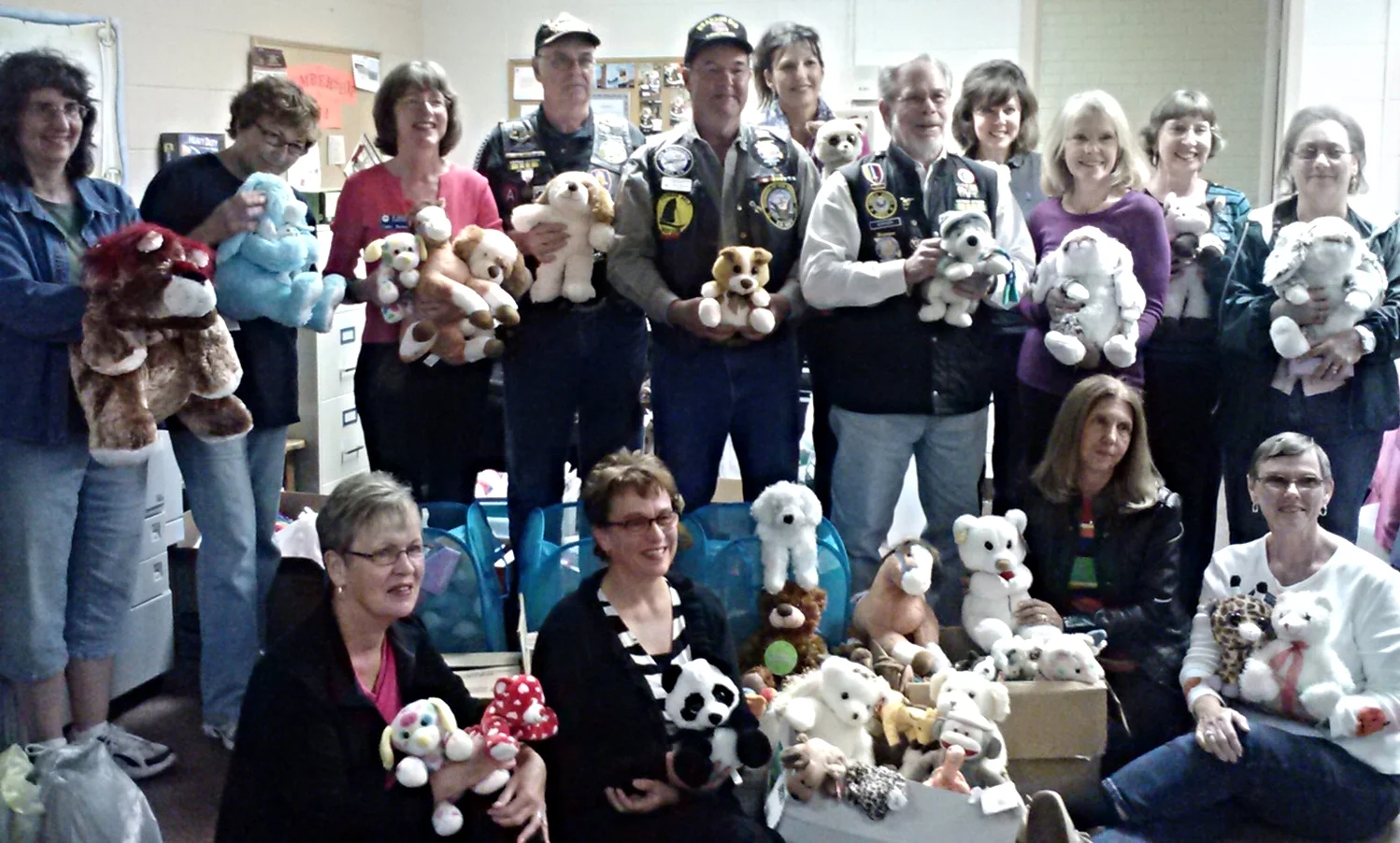Pictured, back row from left, Donna Harris, Nina Grayson, Cathy Brown, Ron Simmons, Roger Womack, Janet Richardson, Robert Sarver, Jennifer Holmes, Rita Parsons, Carol Miller and Lois Simmons; front row, Donna Handel, Karen Oswald, Brenda Galyean and Ginny Hale. Approximately 300 stuffed animals were collected.