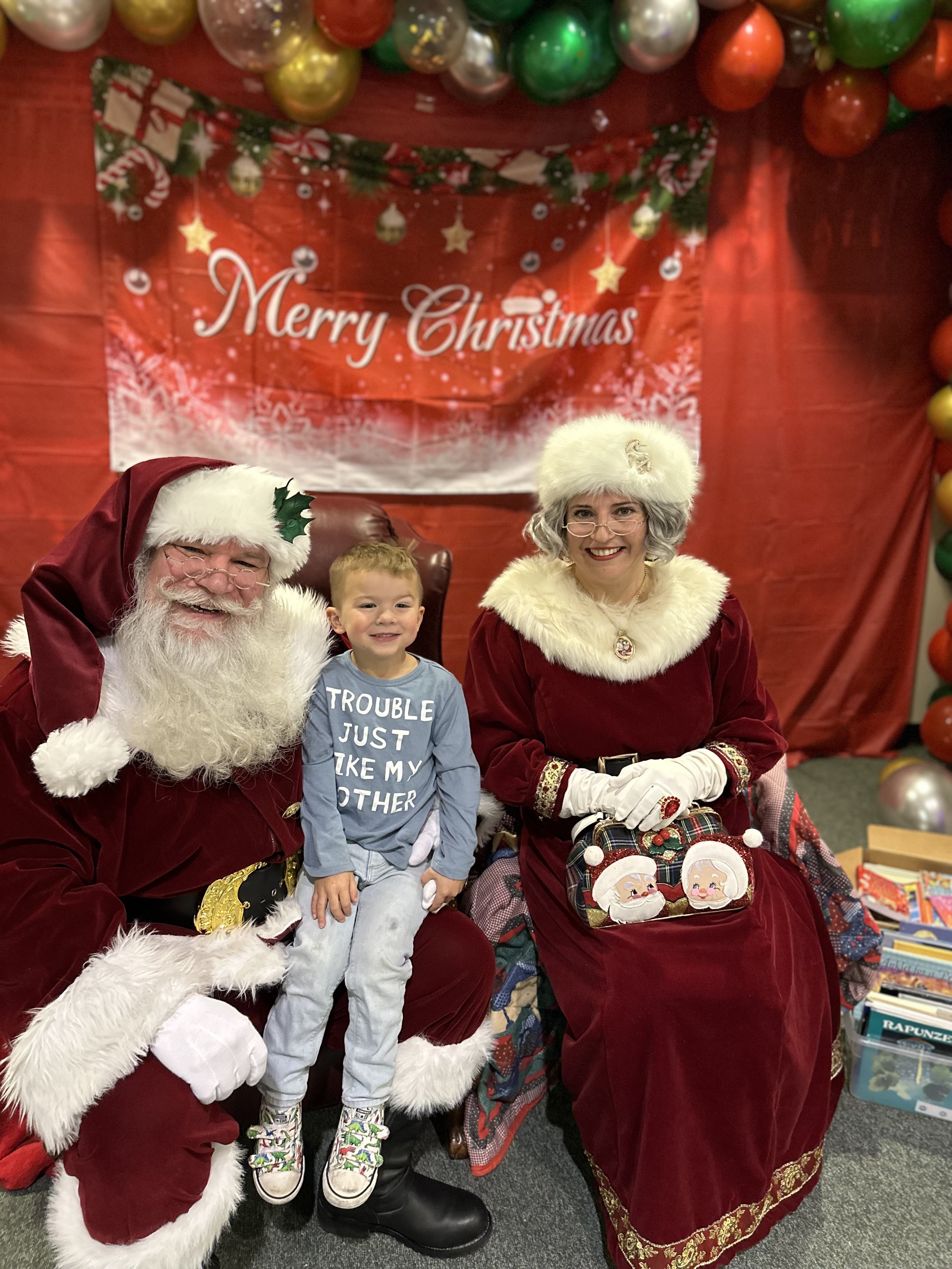 Elijah with Santa and Mrs. Claus.jpeg