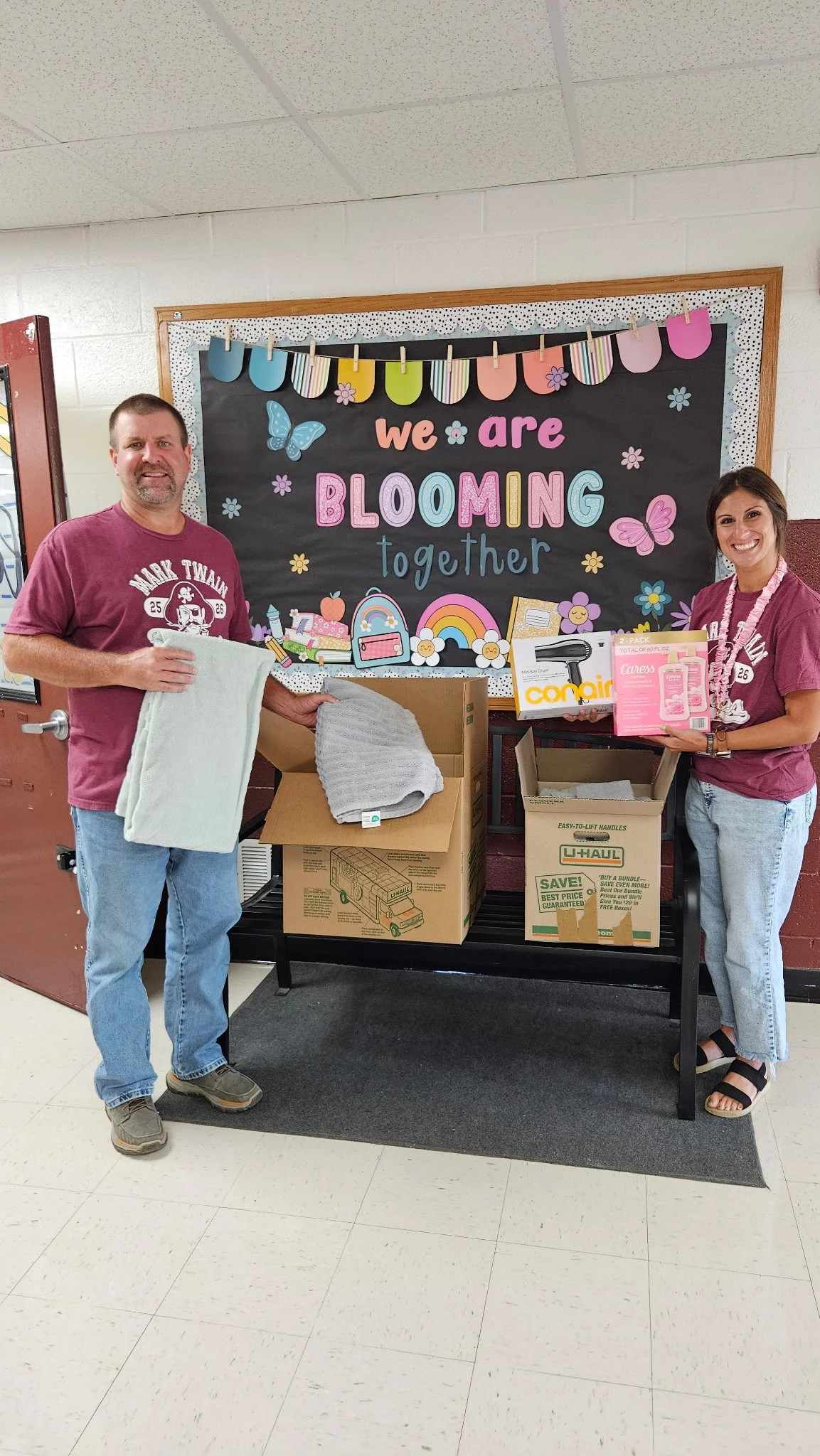 Mark Twain Superintendent Joe Donley and Assistant Principal Shelby Dalton received shower supplies.JPG
