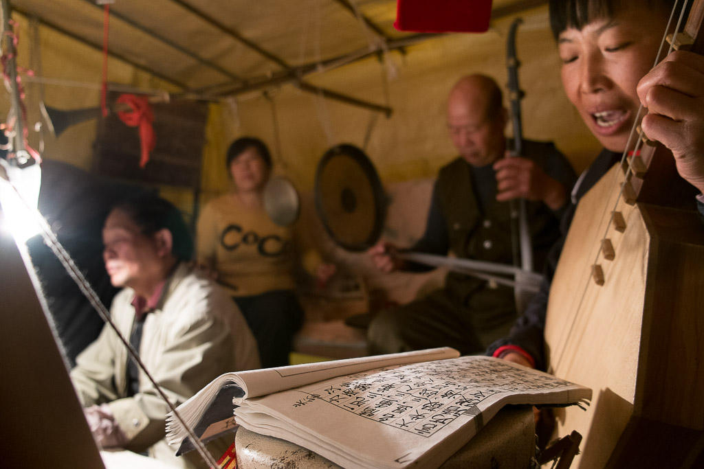 Zhang Xiangling singing from her script