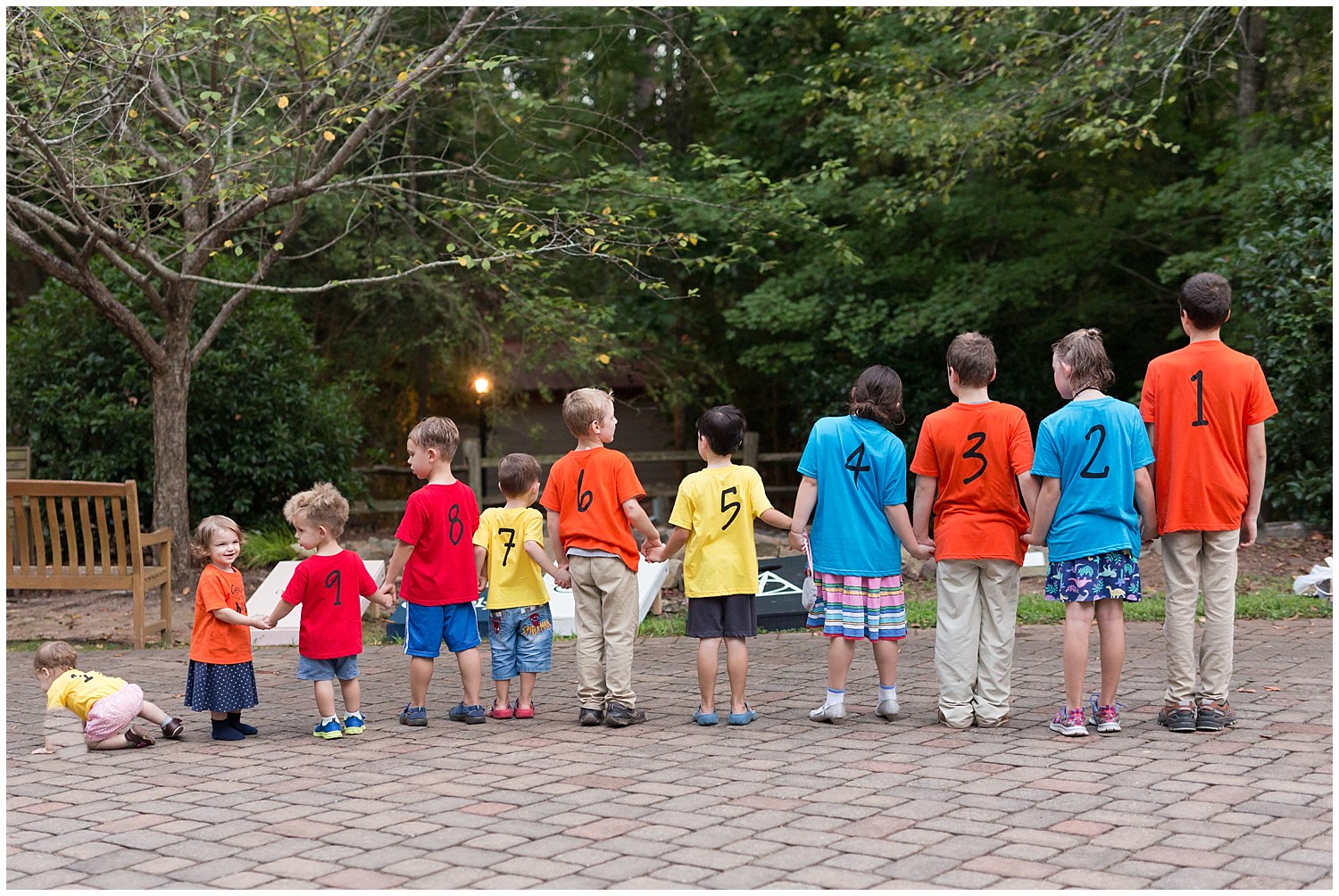 big group of cousins in numbered shirts