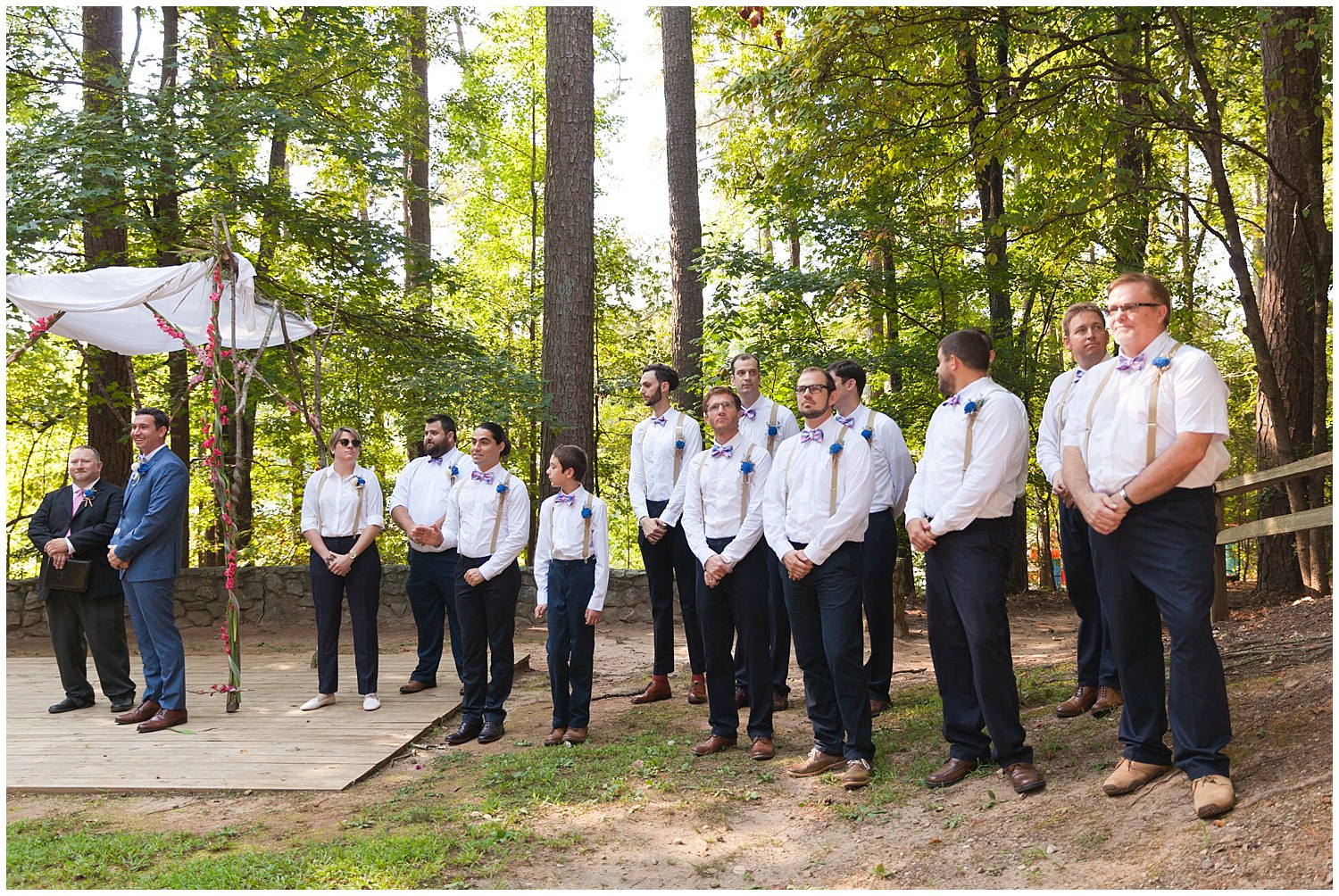 large group of groomsmen at outdoor wedding