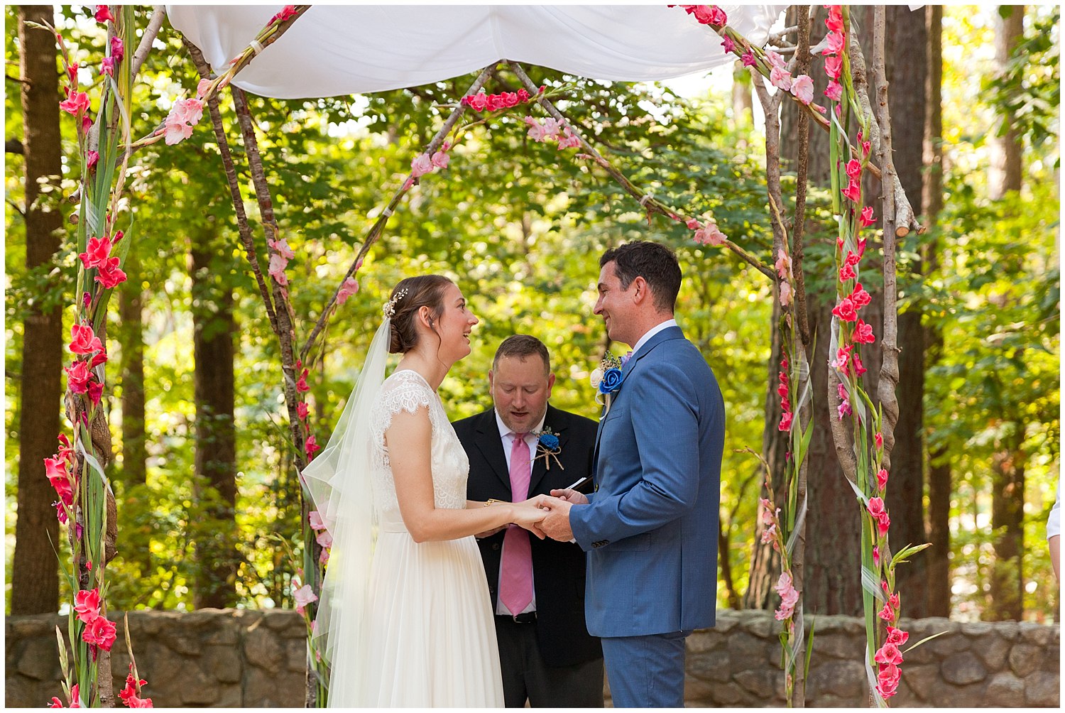 pretty outdoor wedding ceremony with floral chuppah