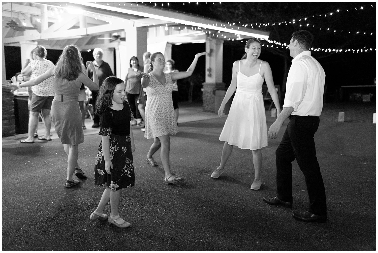 bride and groom on dance floor at casual outdoor wedding reception