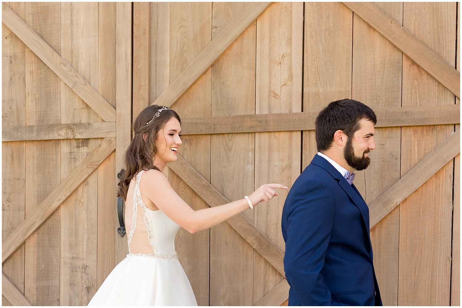 bride tapping groom on shoulder for first look