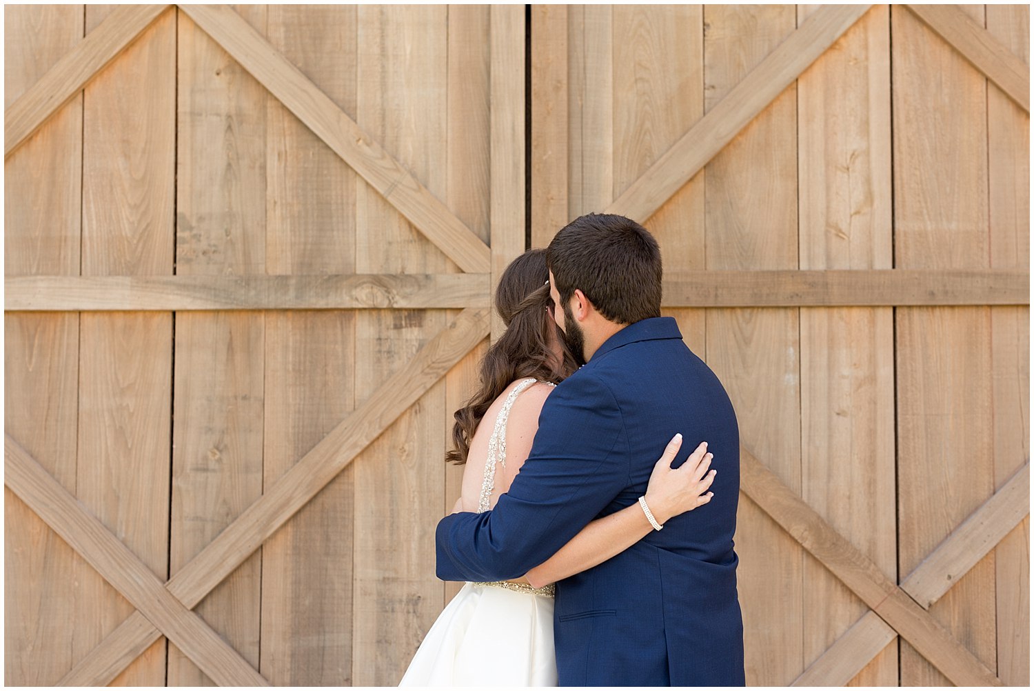 bride and groom hugging during first look before wedding