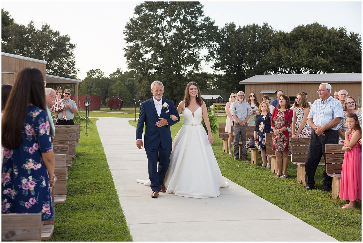 father walking daughter down aisle in Kiln, MS