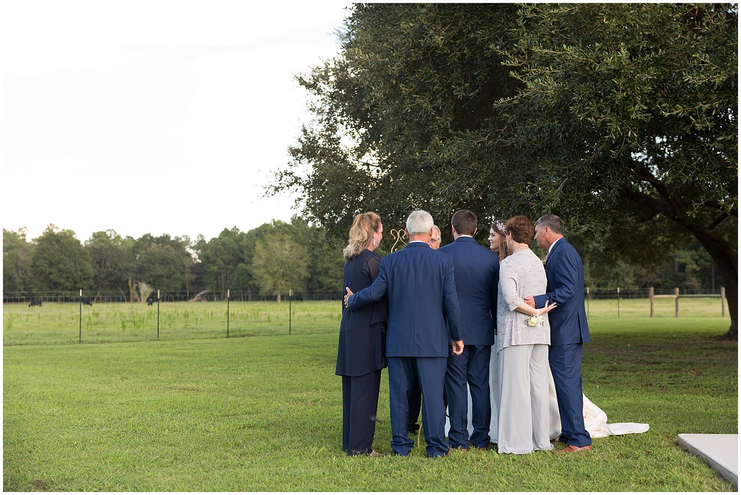 family praying at wedding ceremony