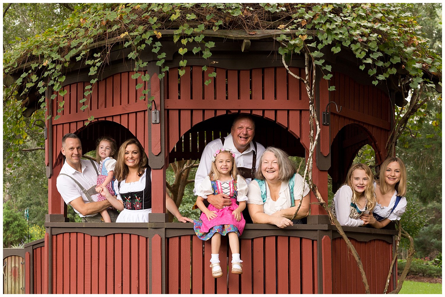 extended family photo with authentic German dirndl and lederhosen in Ocean Springs, MS