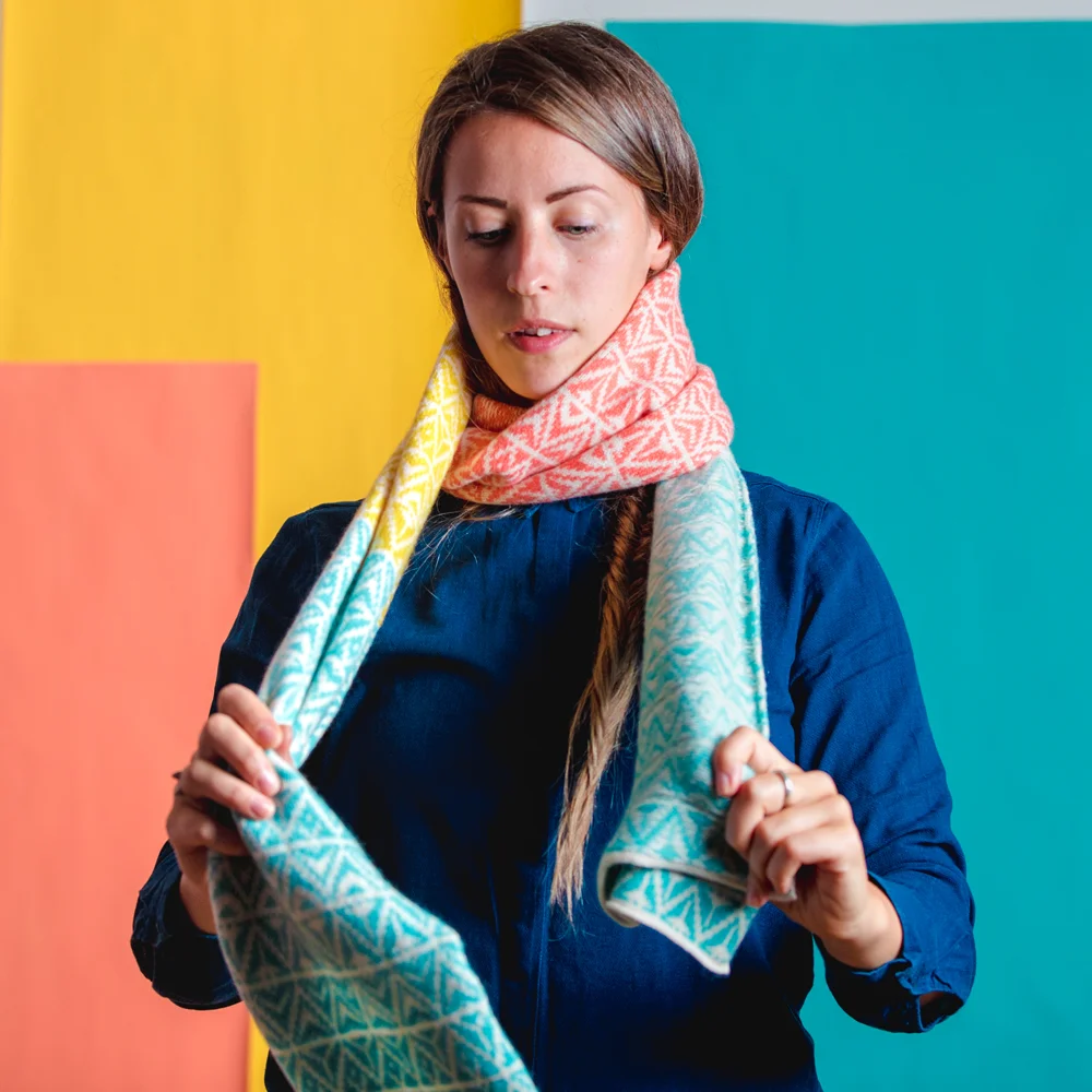 Step 1: loop the scarf around once, keeping it close to the neck.