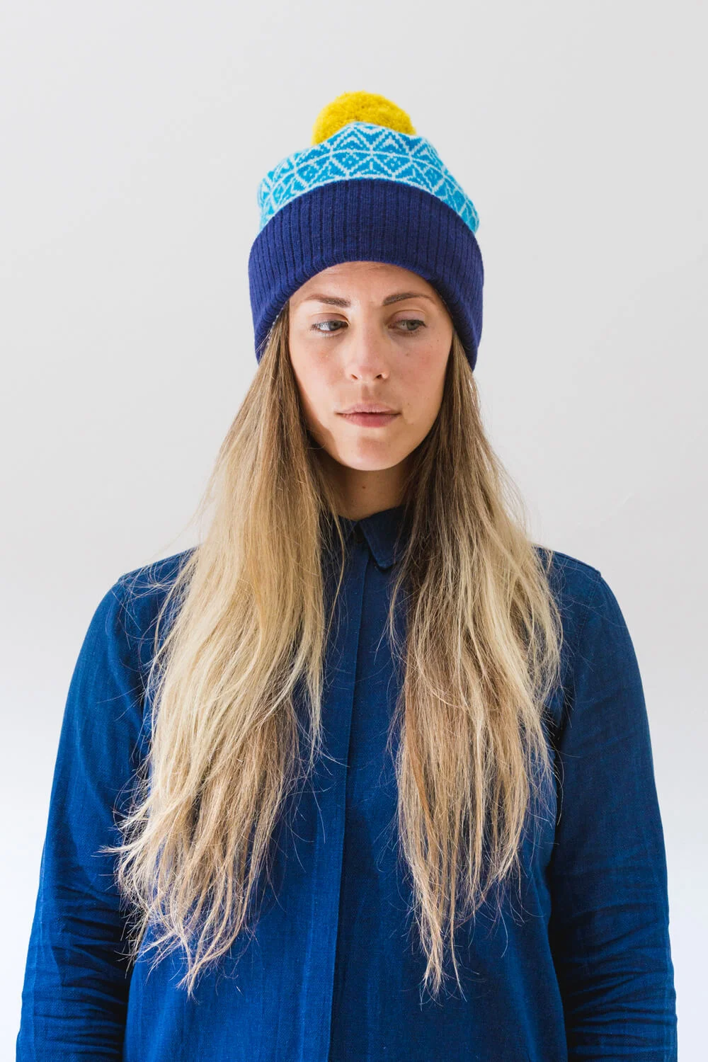 Eden Hat. A thick designer lambswool bobble hat made in Scotland. Luxury Contemporary Scottish Knitwear by Collingwood-Norris