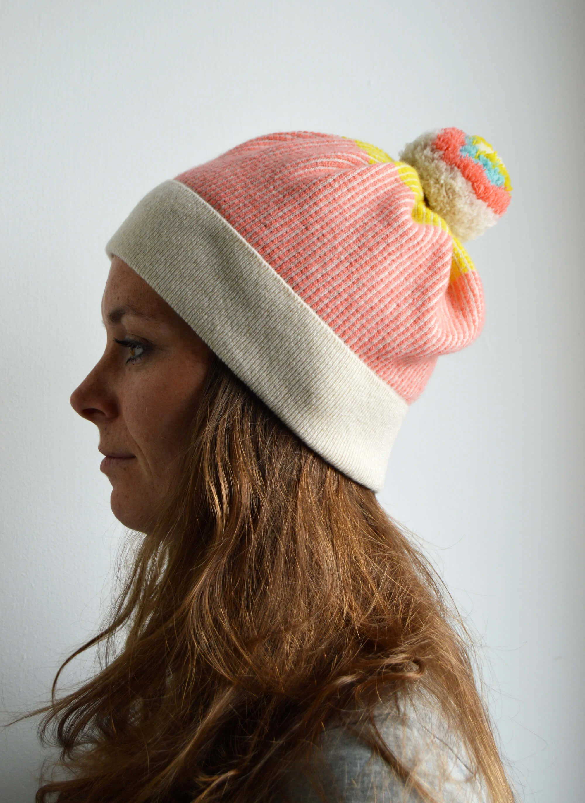 Coral pink Bobble Hat. A premium lambswool pom pom hat Made in Scotland by Collingwood-Norris