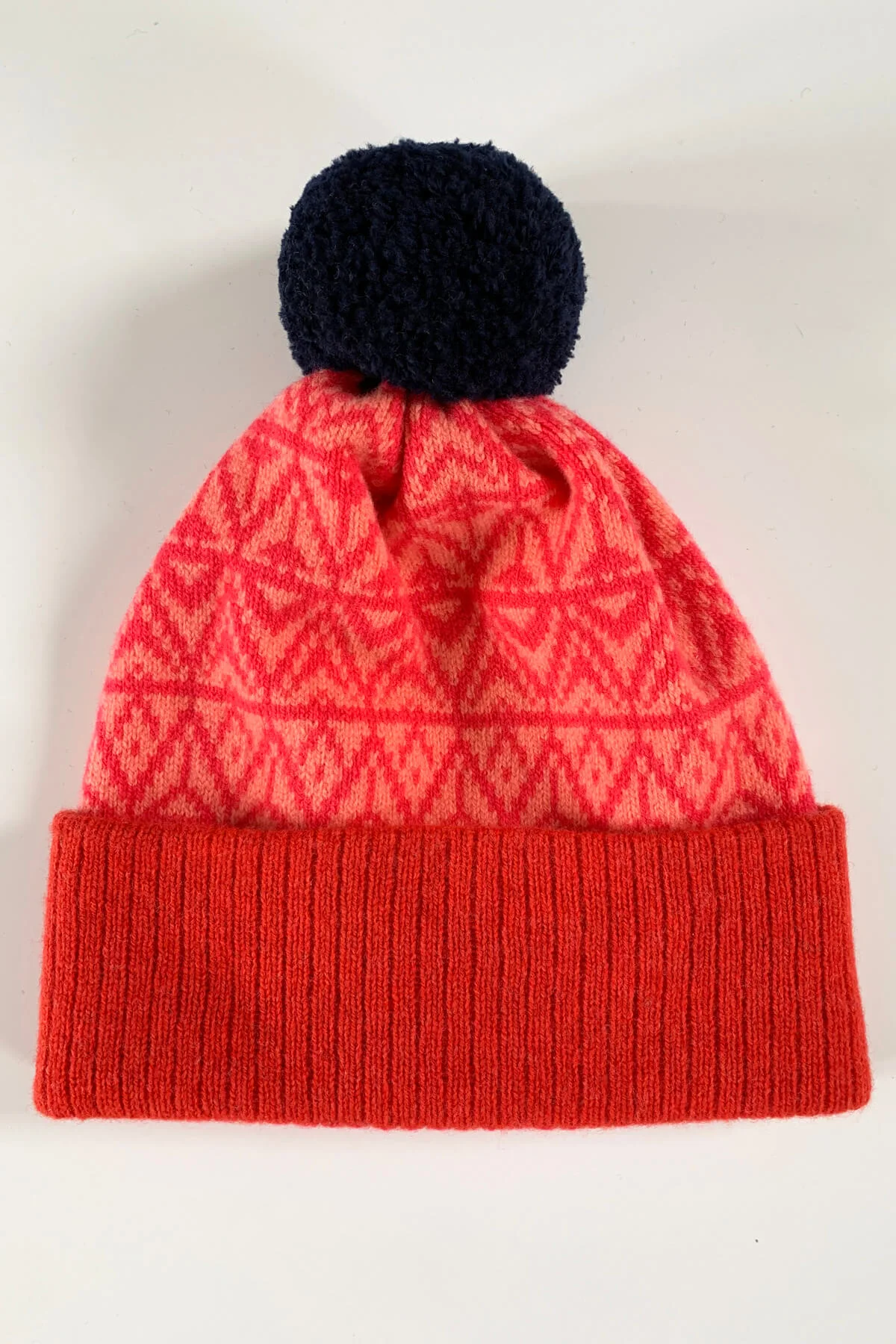 Limited Edition bobble hat in red, pink and coral. Made in Scotland with premium lambswool by Collingwood-Norris