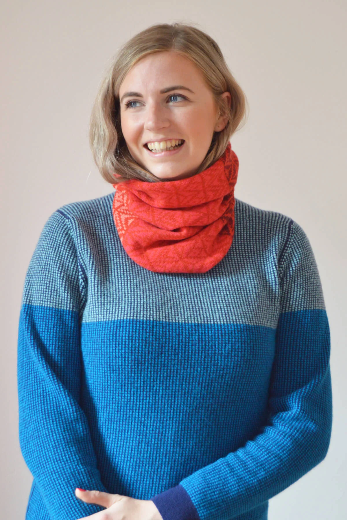 Red and pink lambswool cowl by Collingwood-Norris. Luxury knitwear handmade in Scotland