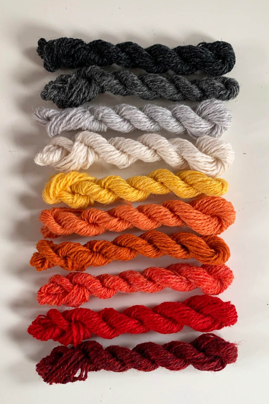 Darning wool in greys and warm tones