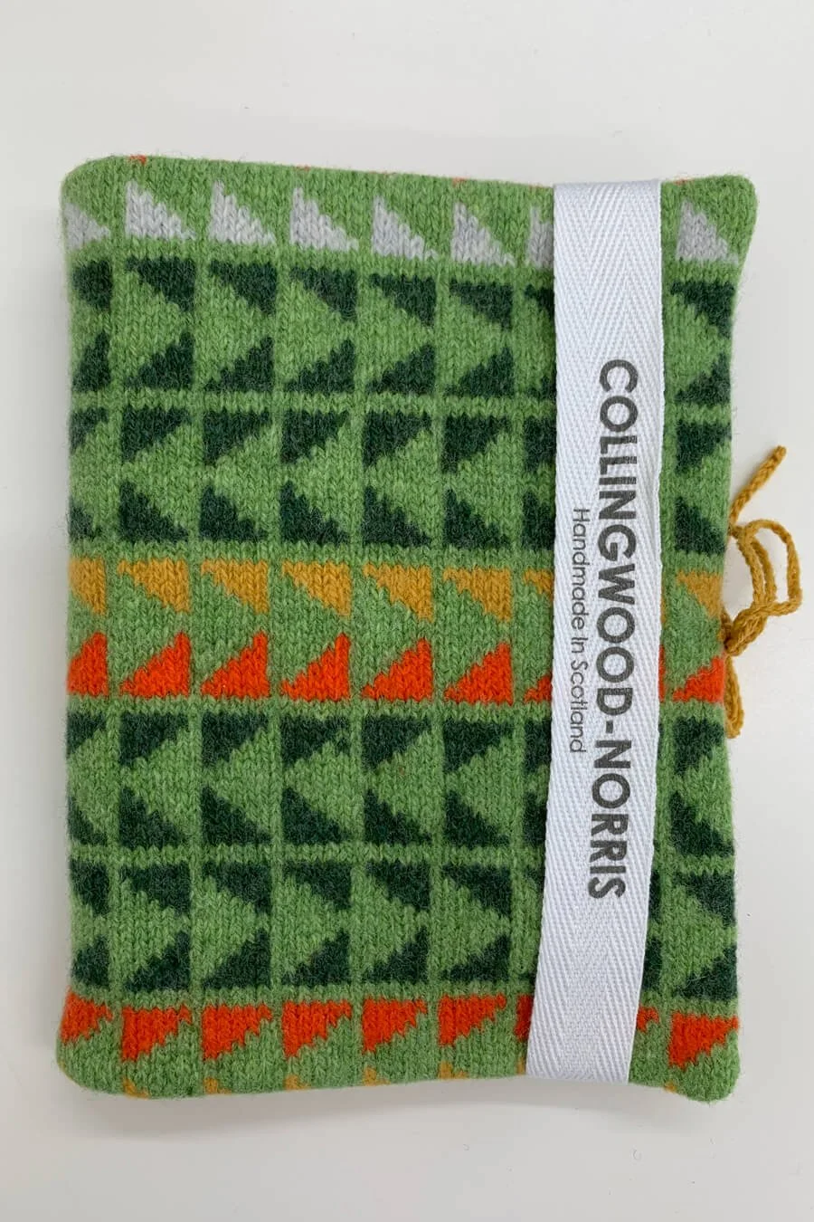 Visible mending kit in green with yellow and orange including darning needles by Collingwood-Norris.jpg
