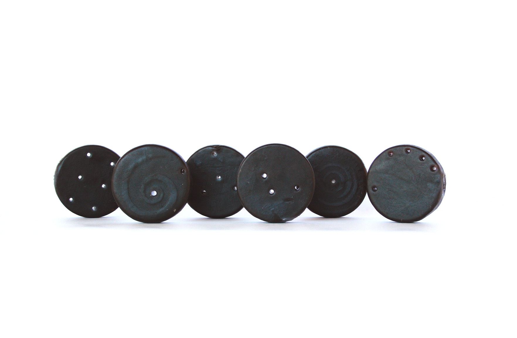 Christine Kettaneh, Soap Coins, post-side1, laser-engraving on soap, 2014.