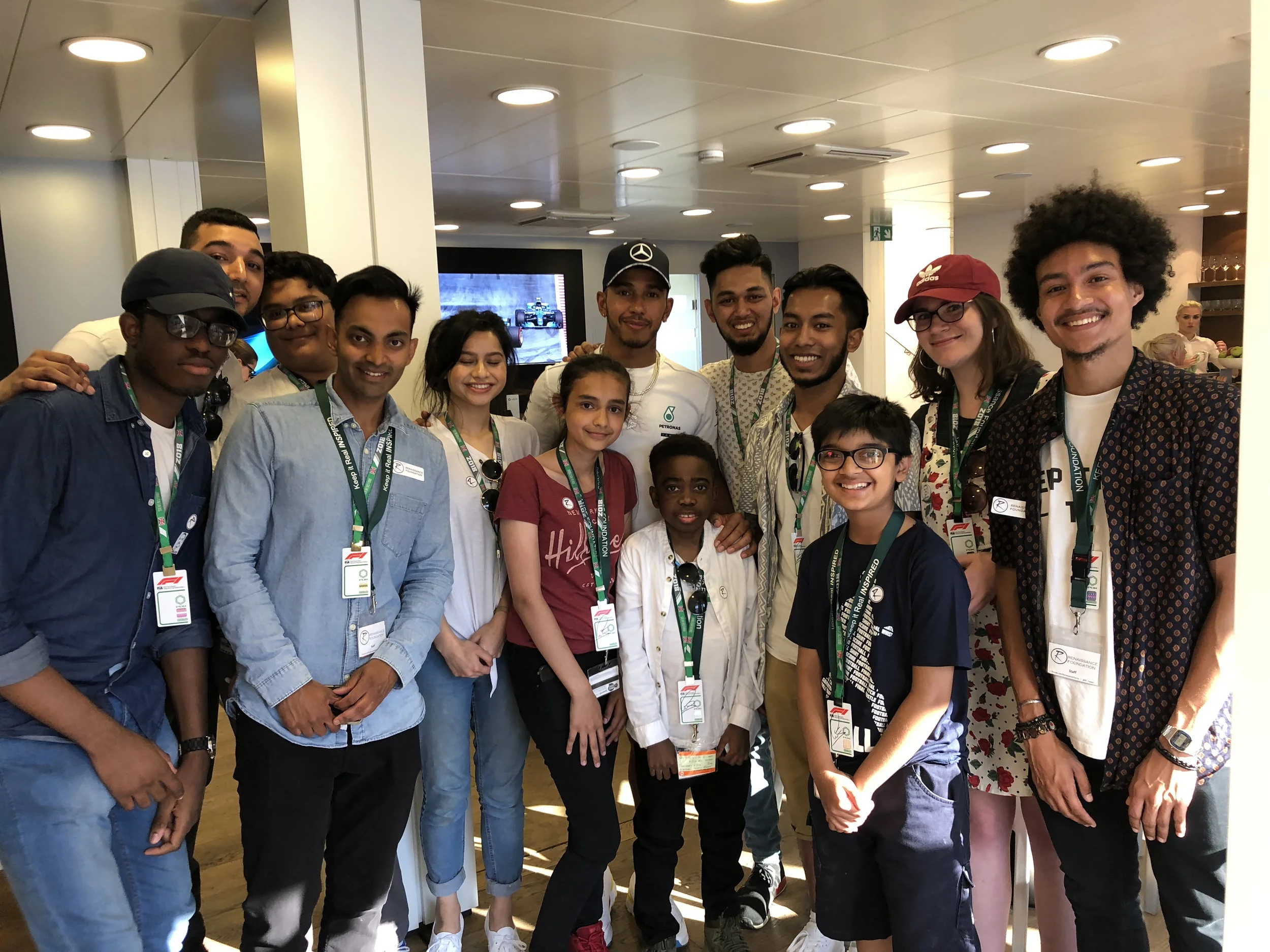 Our Young Leaders meeting Lewis Hamilton, who was himself a young carer, at the F1 Press Day at Silverstone in 2018.