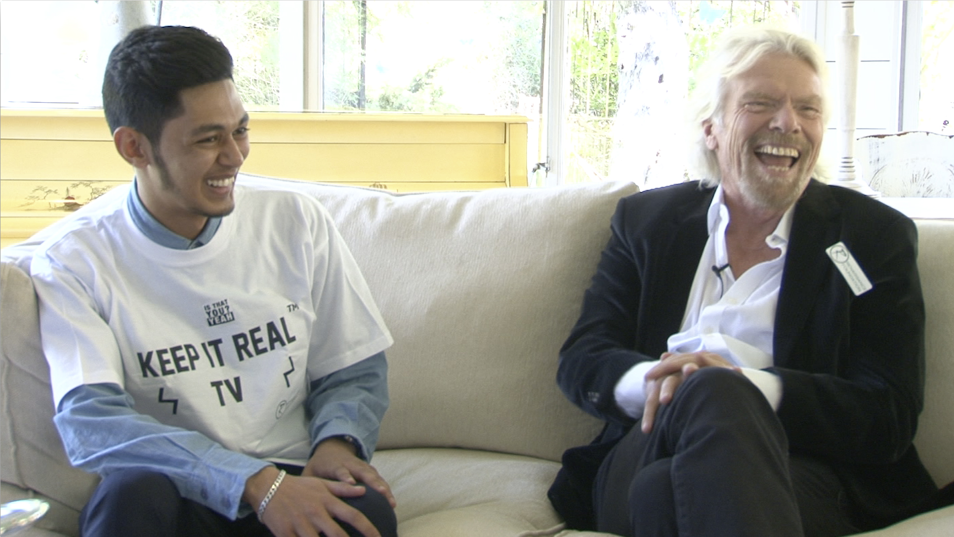 A young leader interviewing Richard Branson