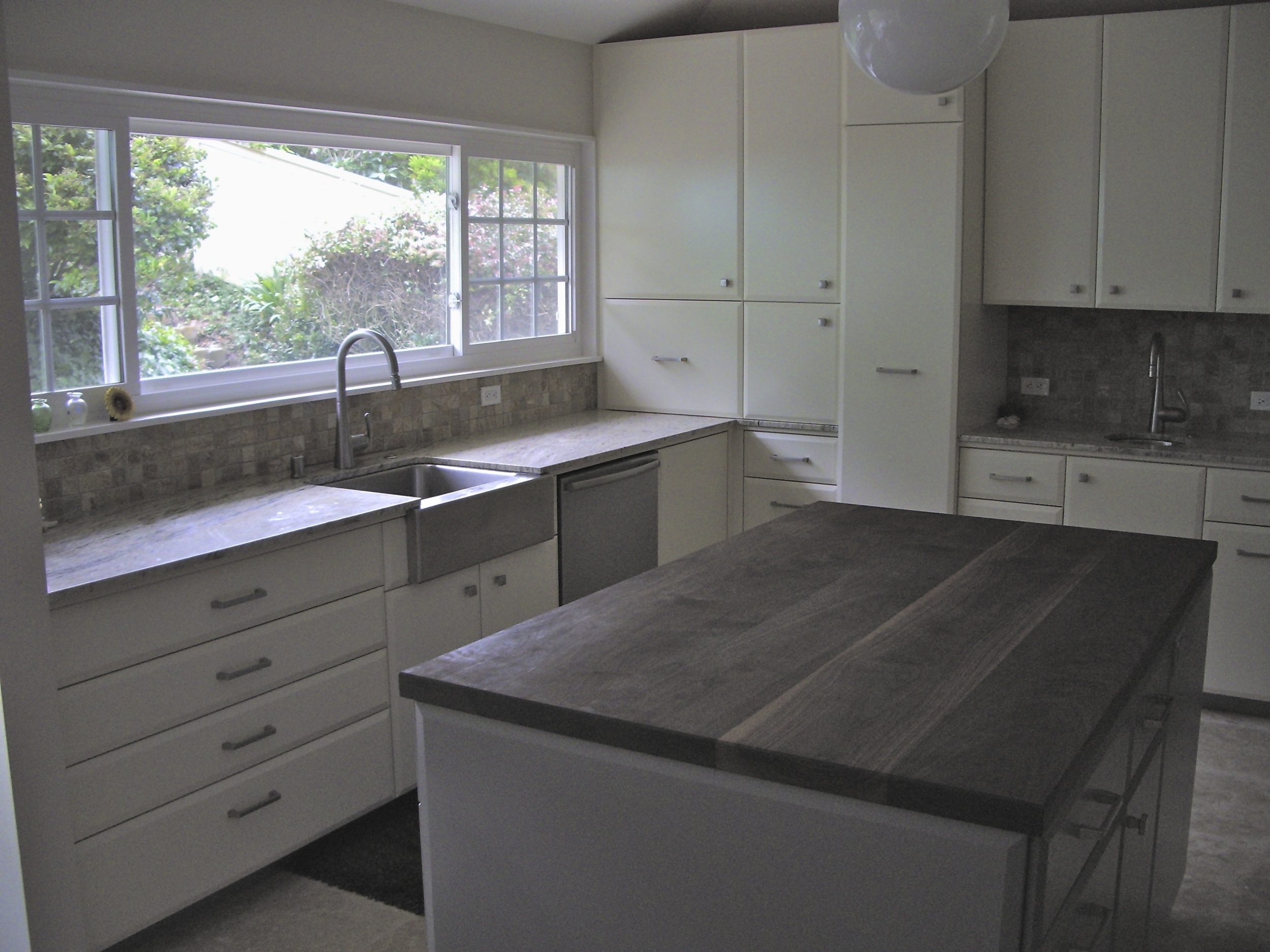 Cabinets feature many pull out drawers with soft close hardware.