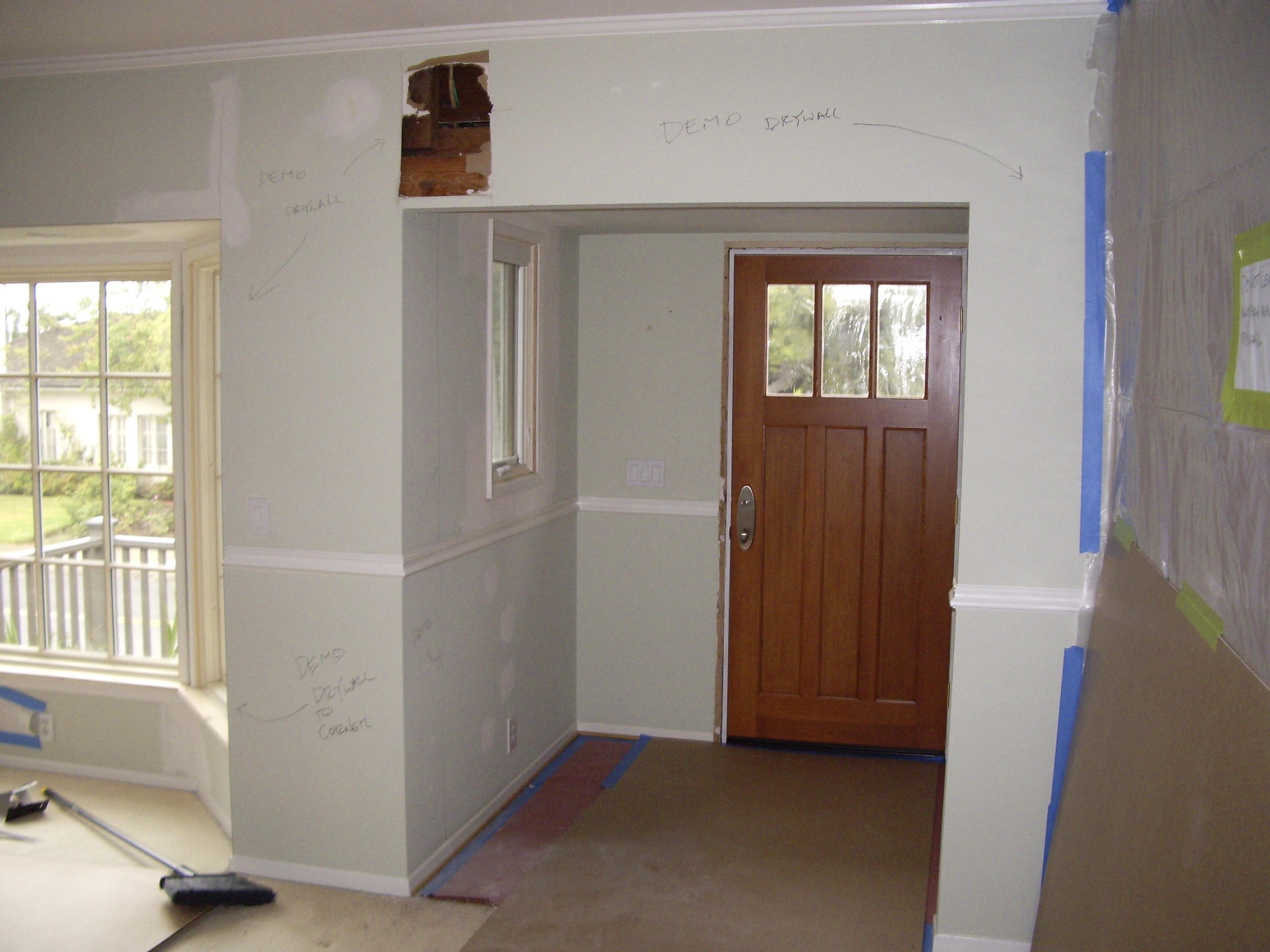  Before: Unwelcoming foyer with low ceiling. 