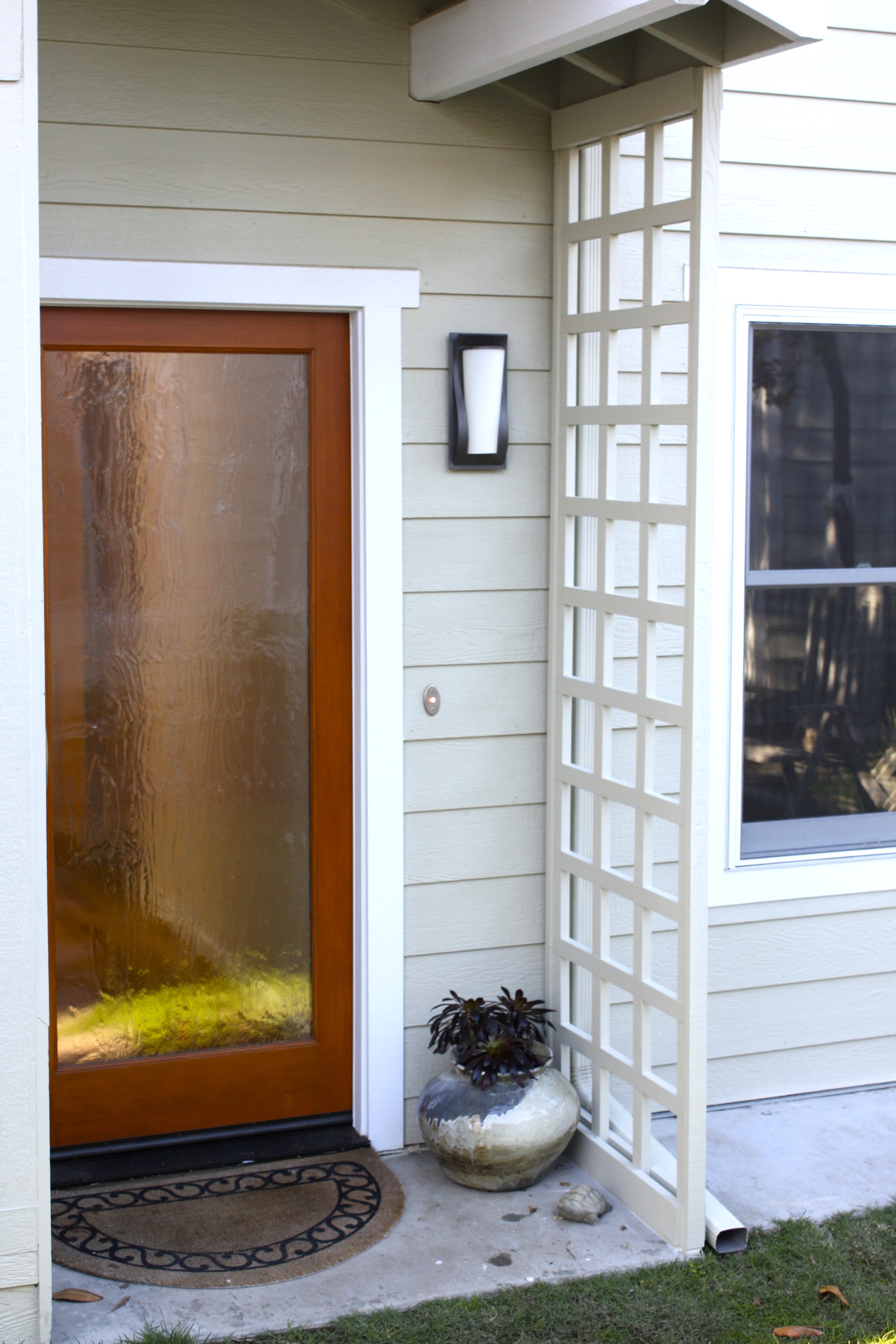  Rear entrance features trellis,&nbsp;ready for plants to climb upon it. 