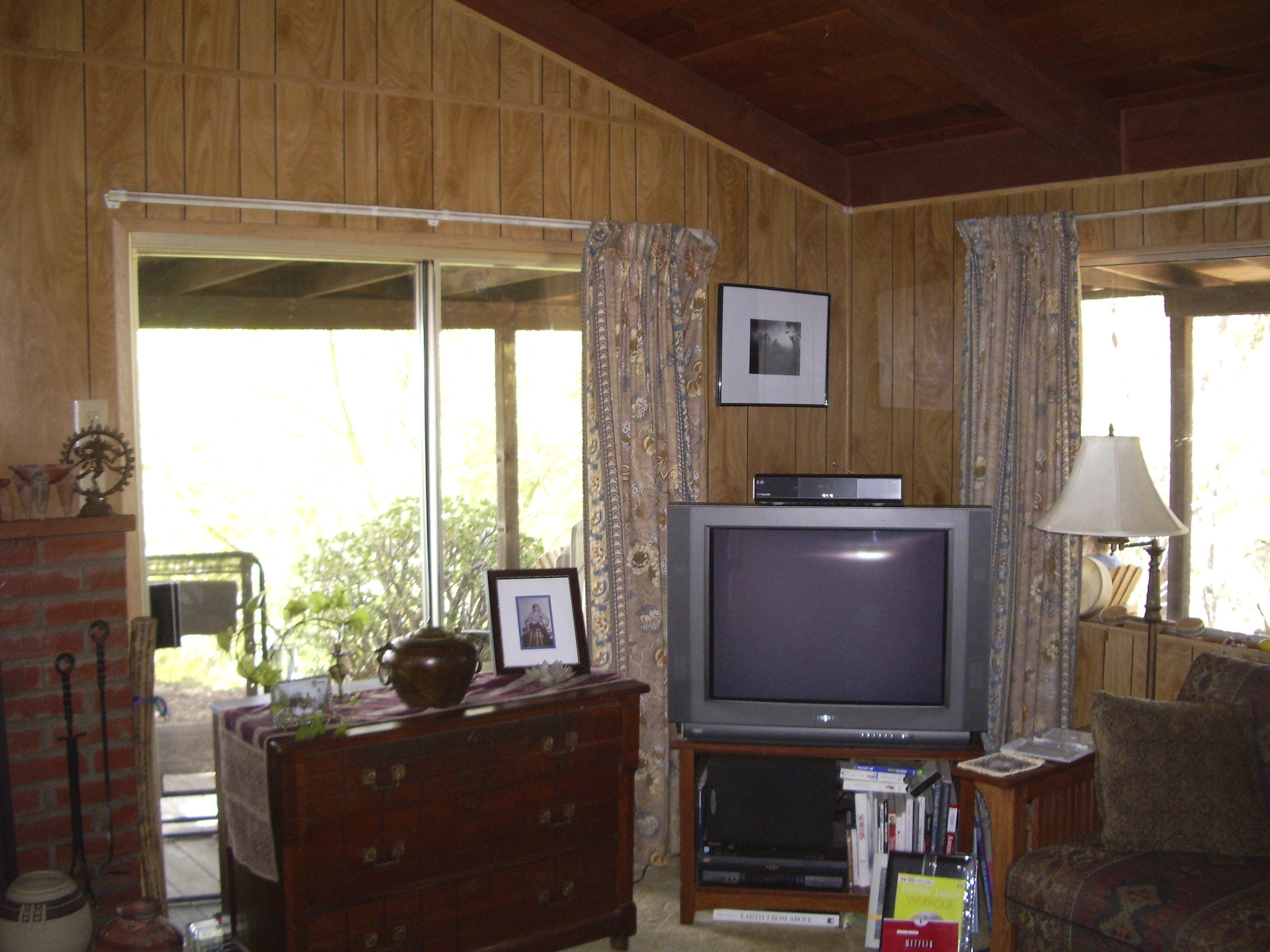 Before: Ugly paneling on walls but beautiful plank and beam ceilings that will feature nicely with light color drywall walls.