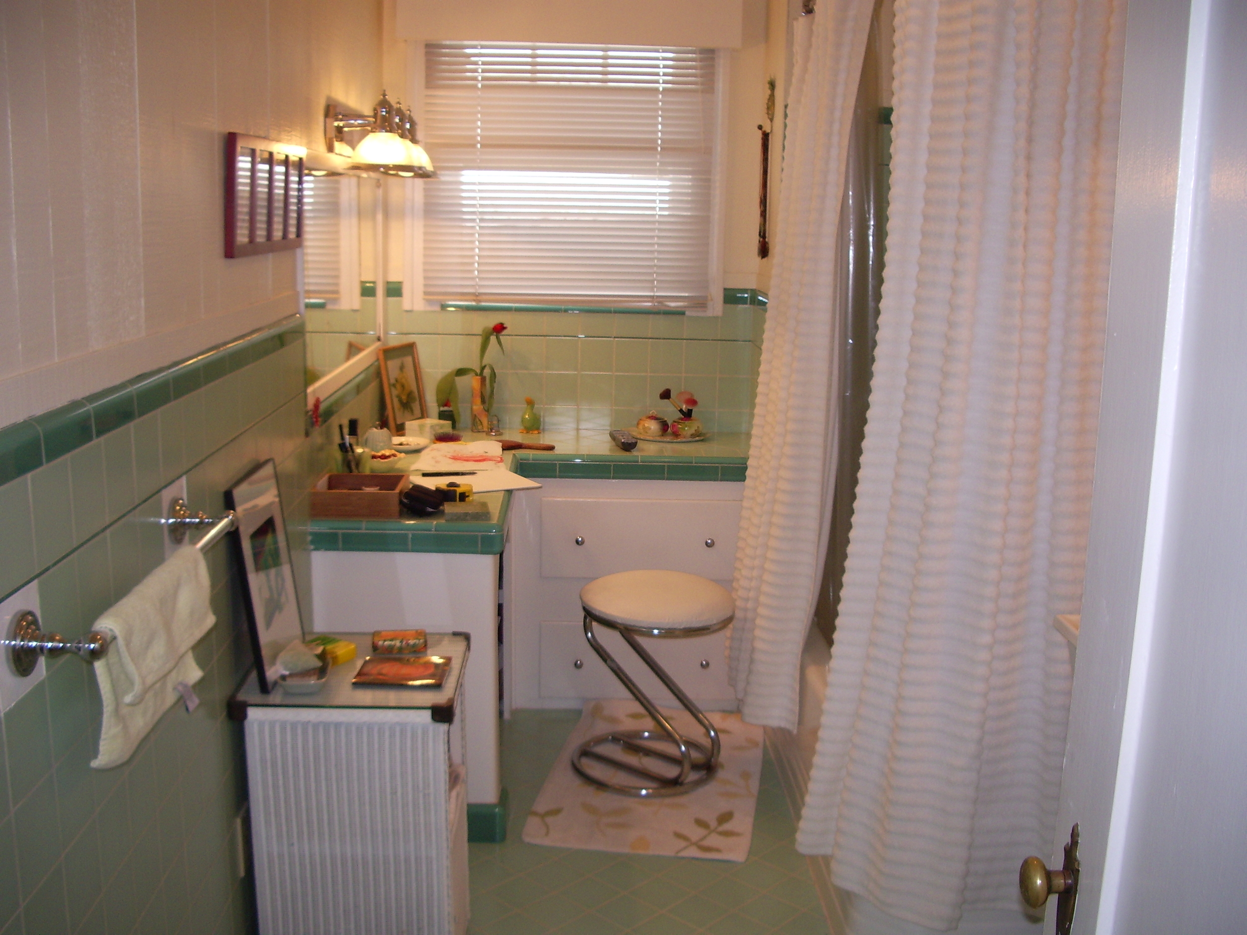  Before:&nbsp;Painted wood cabinets, cloth shower curtain. 