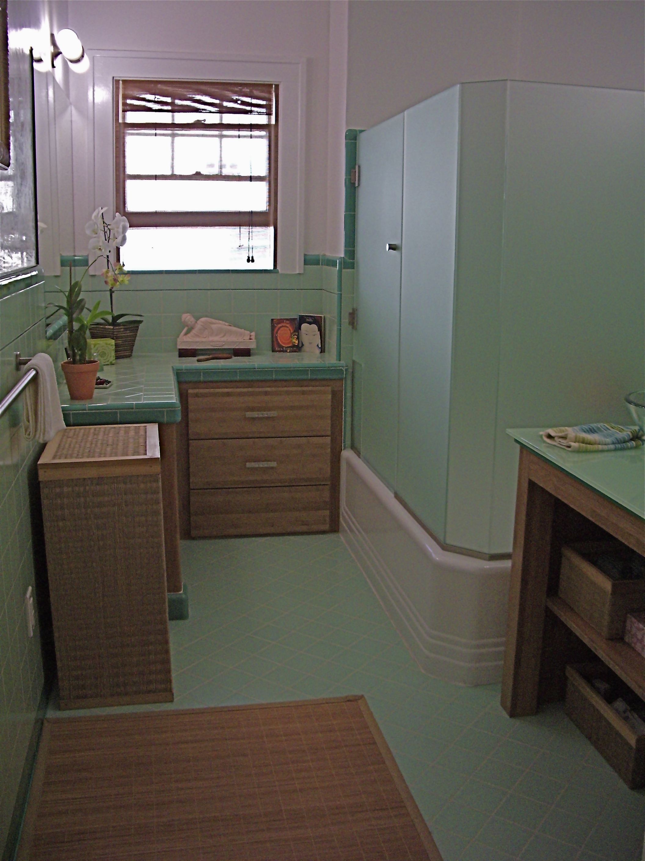  After:&nbsp;Bamboo plywood cabinetry,&nbsp;bamboo area rug, Buddah&nbsp;relaxing next to window. 