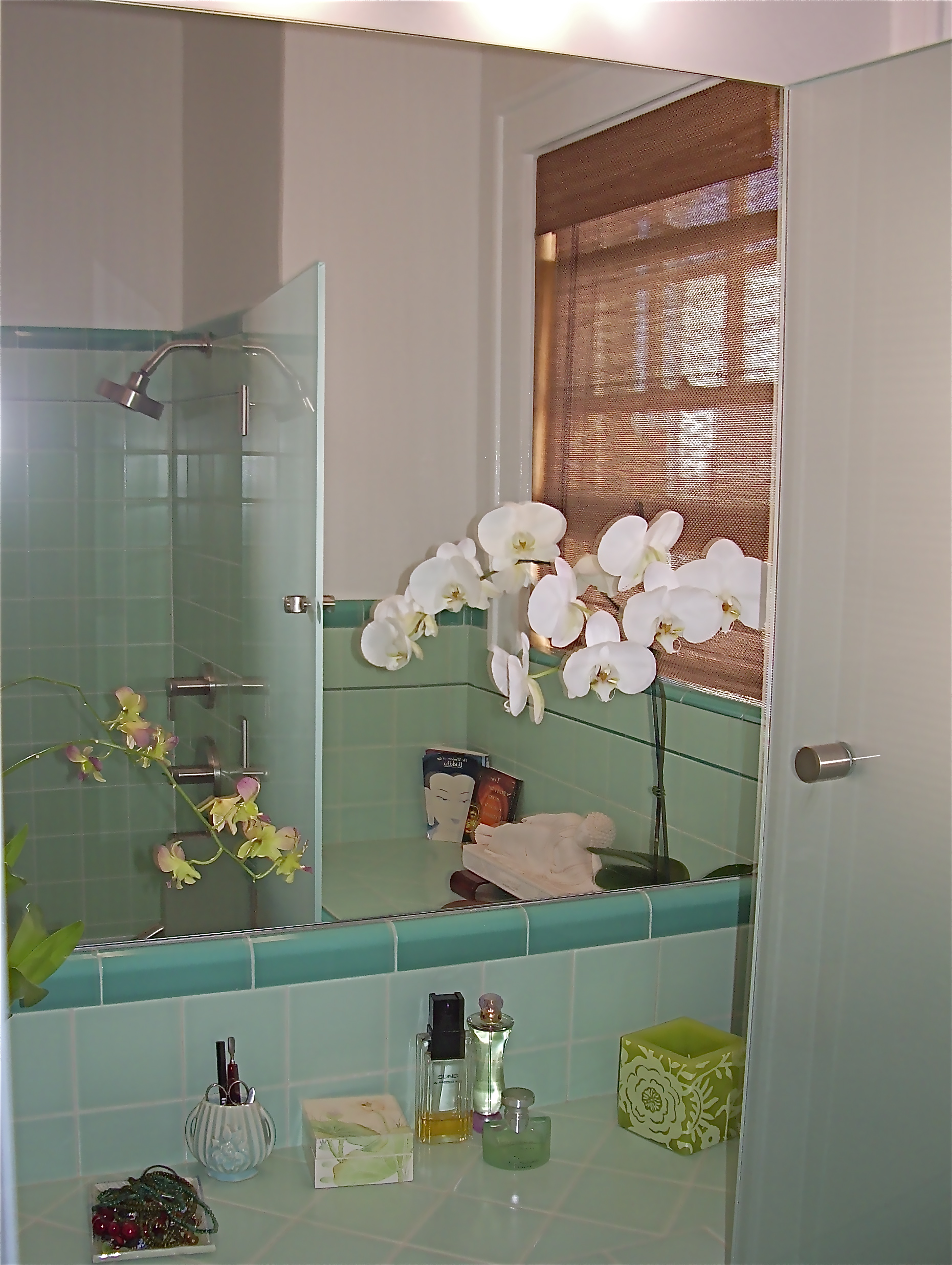  After:&nbsp;Original counter with new mirror and&nbsp;light looking from&nbsp;tub / shower. 