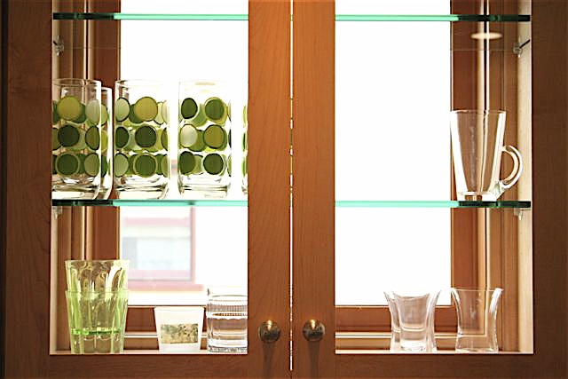  R. Lyle Boatman, designer for the project, created this amazing way to bring in more natural light to the kitchen by putting fixed windows in the cupboards. 