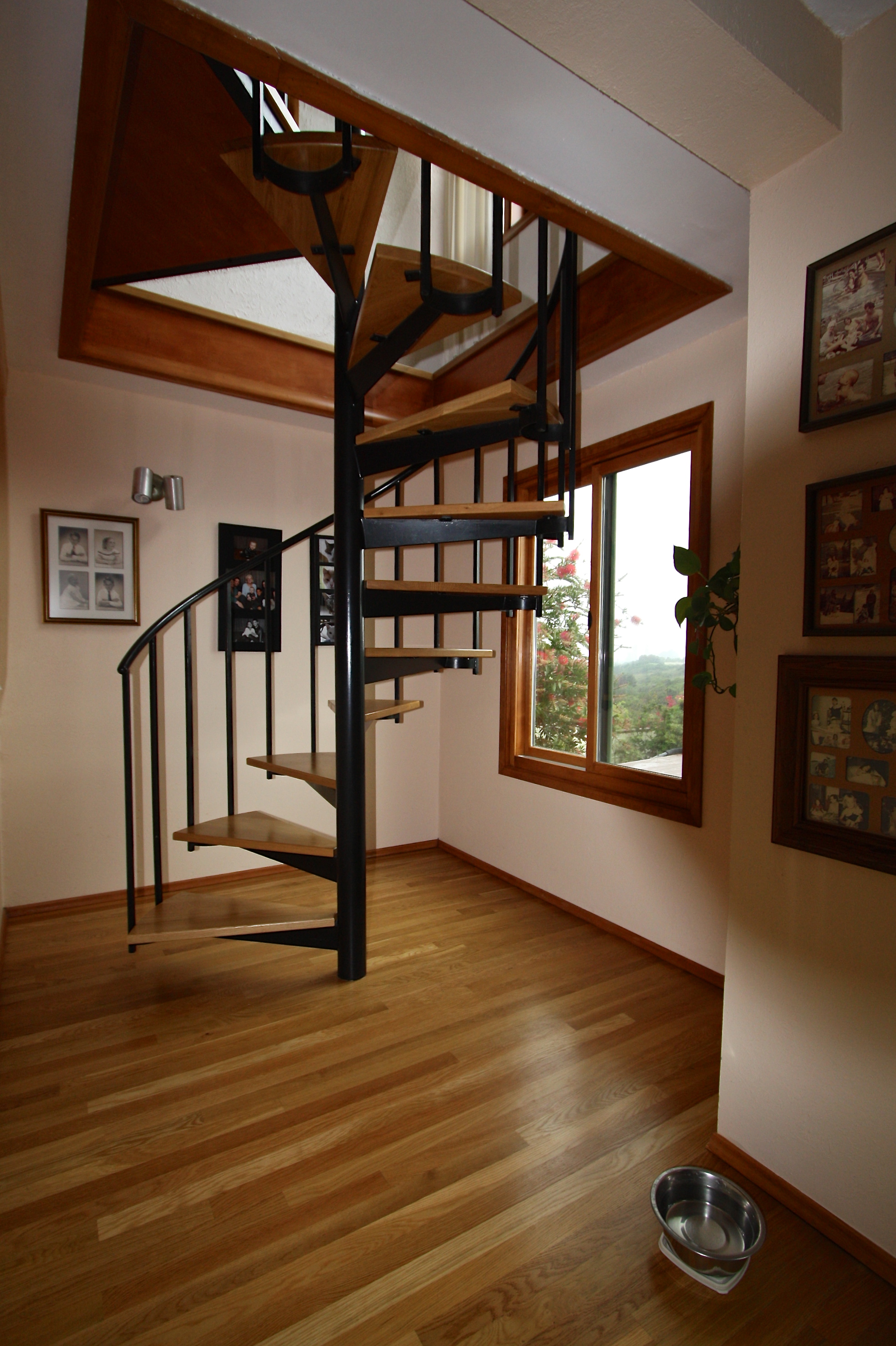  After: Oak floor and spiral stair treads. 