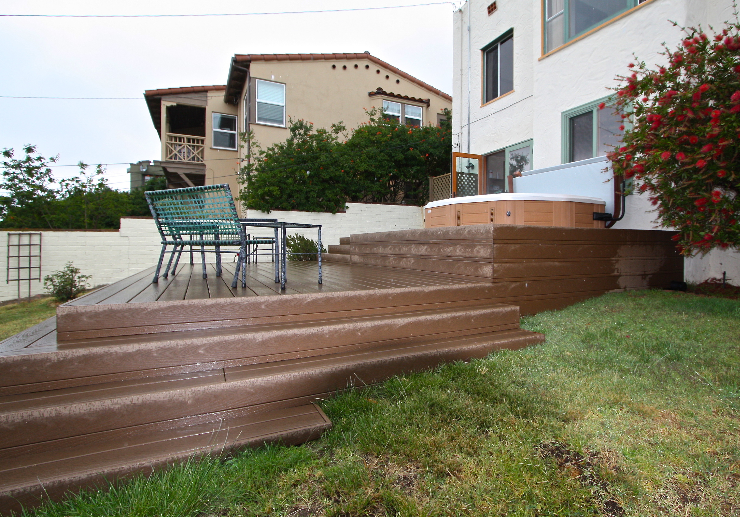  After: Deck follows contour of the yard, a lattice enclosure screen&nbsp;utilities from view. 