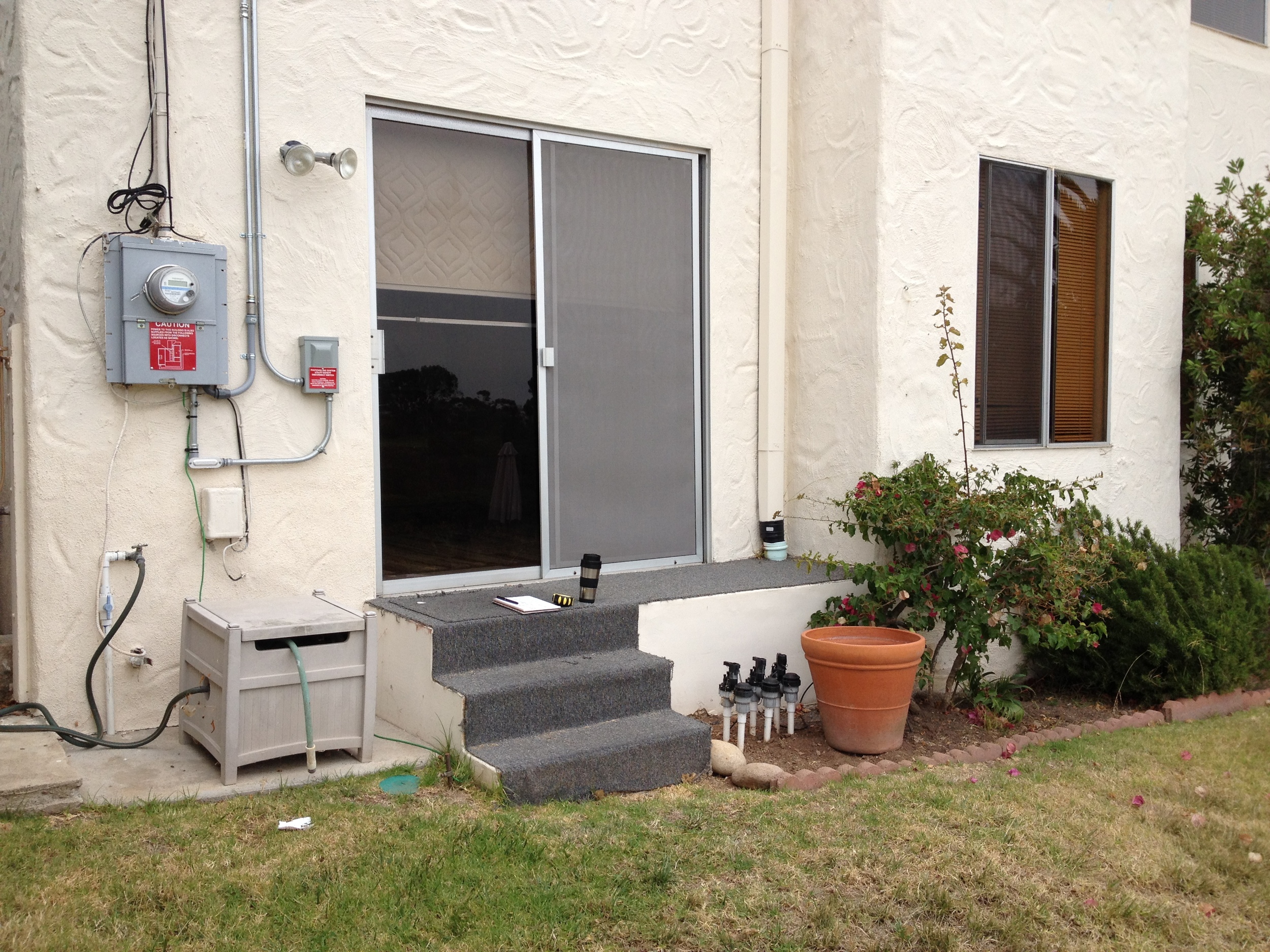  Before: Sliding door and steps to back yard. 