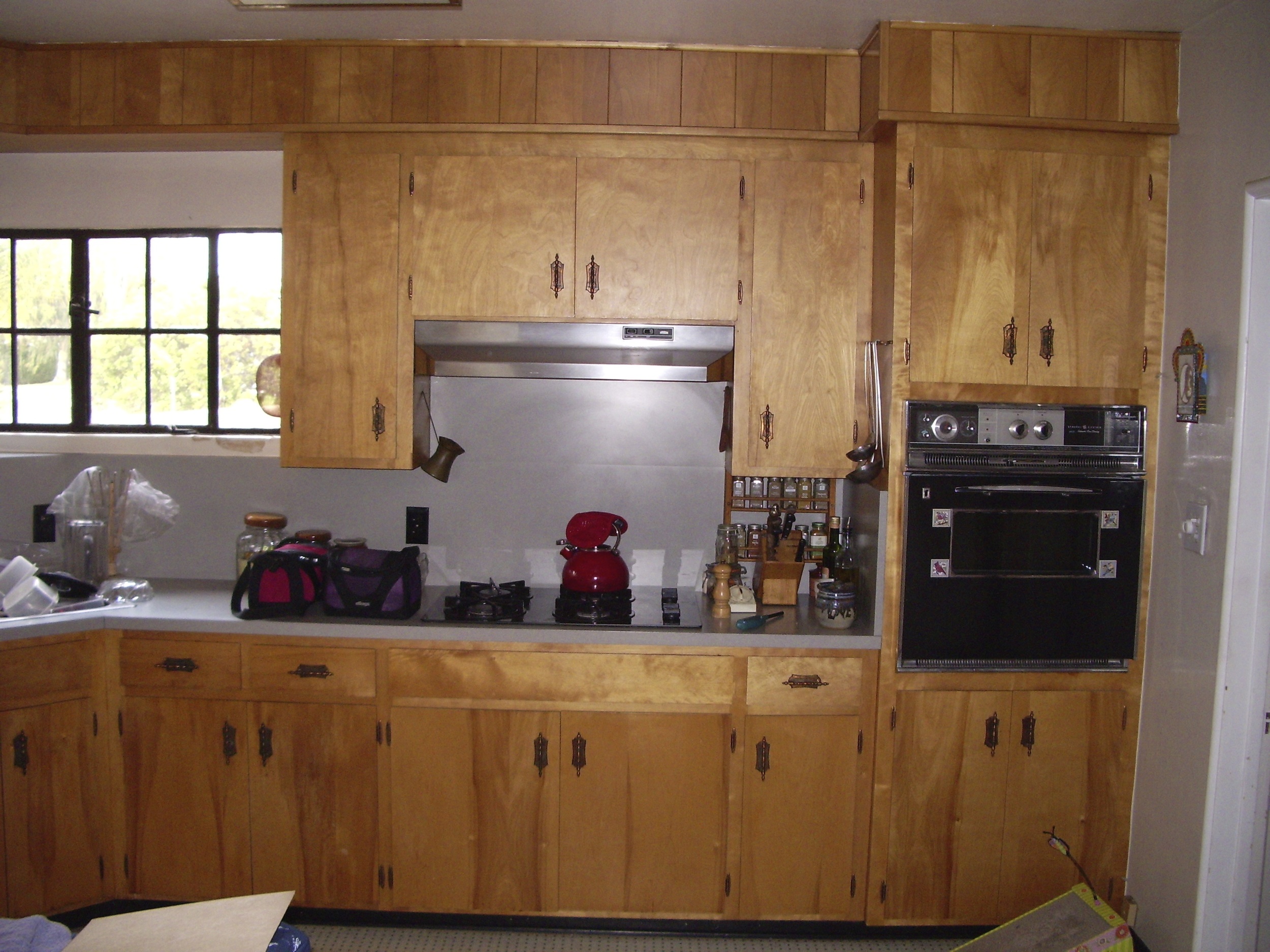  Before: Old site-built cabinets. 