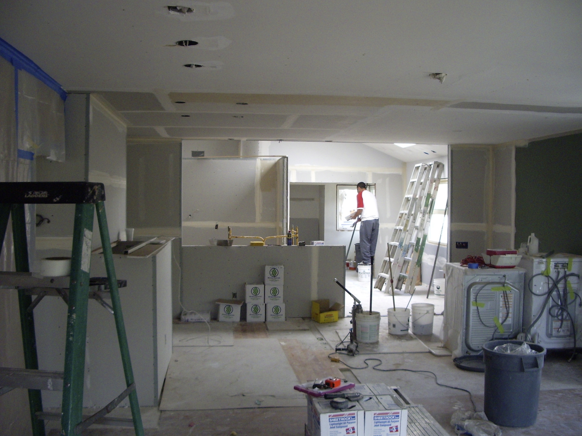  Living room looking toward kitchen, dining room and art studio. 