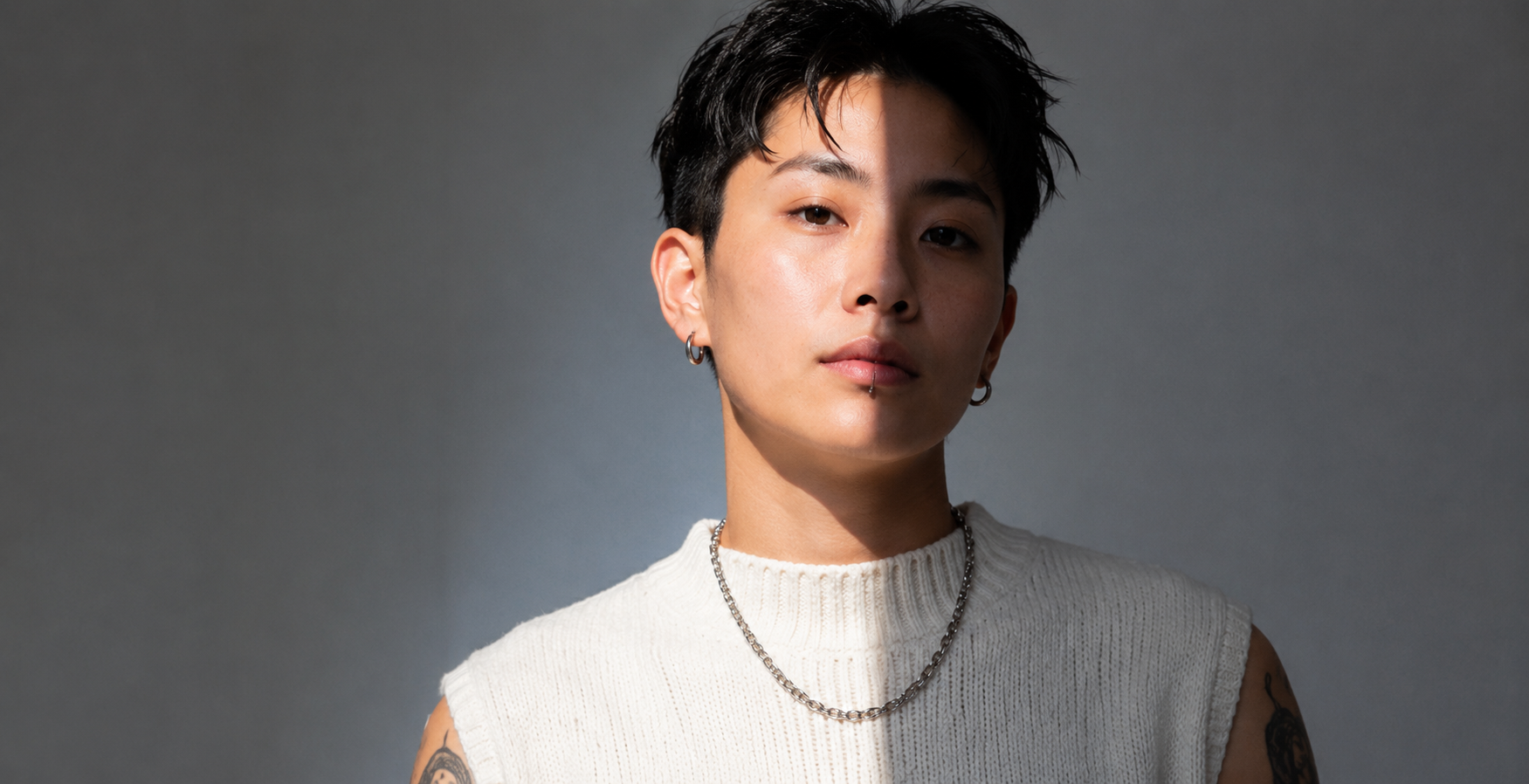 Queer Asian-American adult portrait for LGBTQ+ affirming psychotherapy serving creatives, engineers, and multicultural professionals.