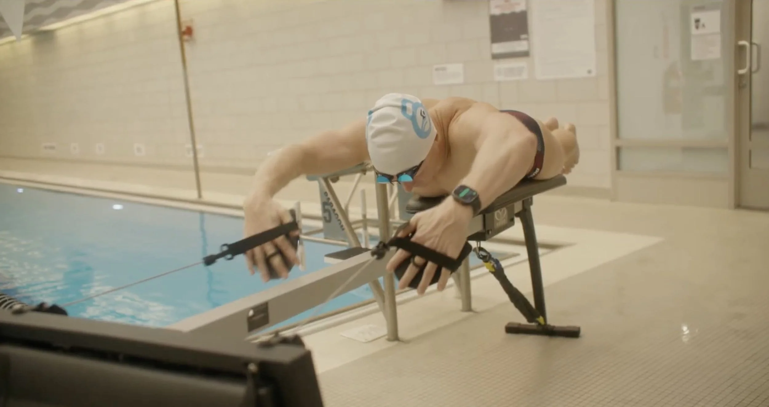 Swim coach Dan Daly warming up before swimming