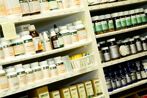  Vitamin and Mineral supplement bottles sitting on shelf. 