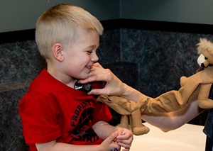  Young boy getting lungs checked with stethoscope. 