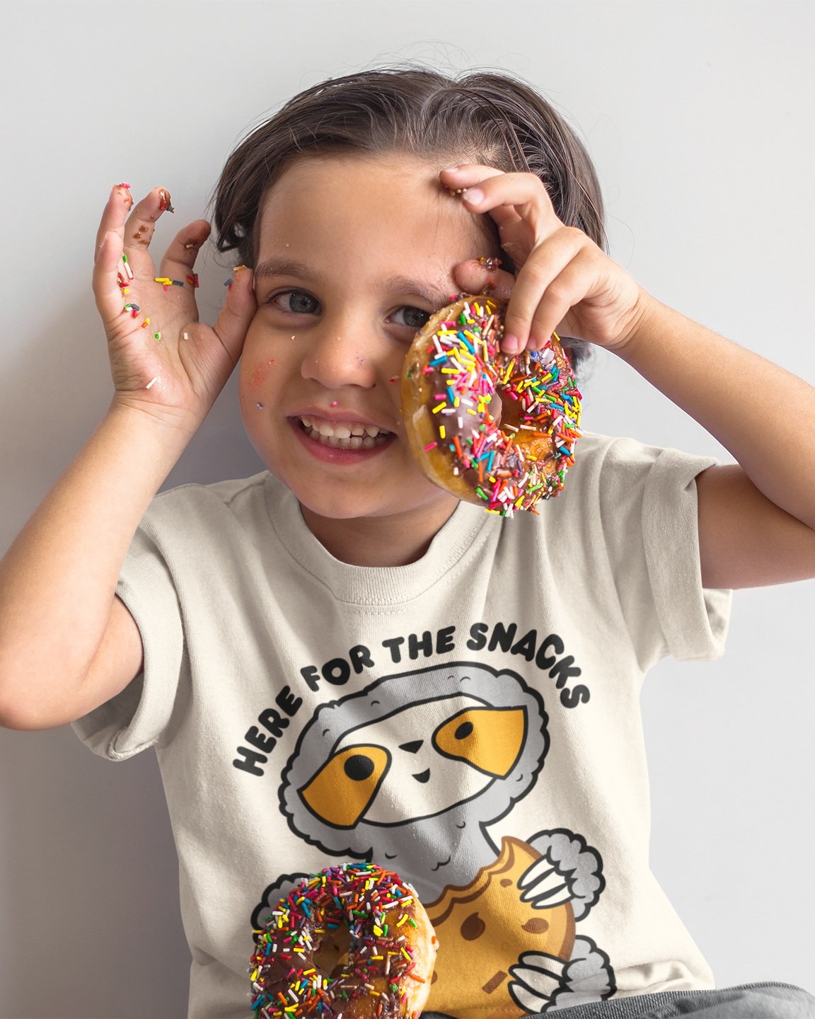 mockup-of-a-happy-kid-playing-with-donuts-while-wearing-a-round-neck-t-shirt-a16150.jpg