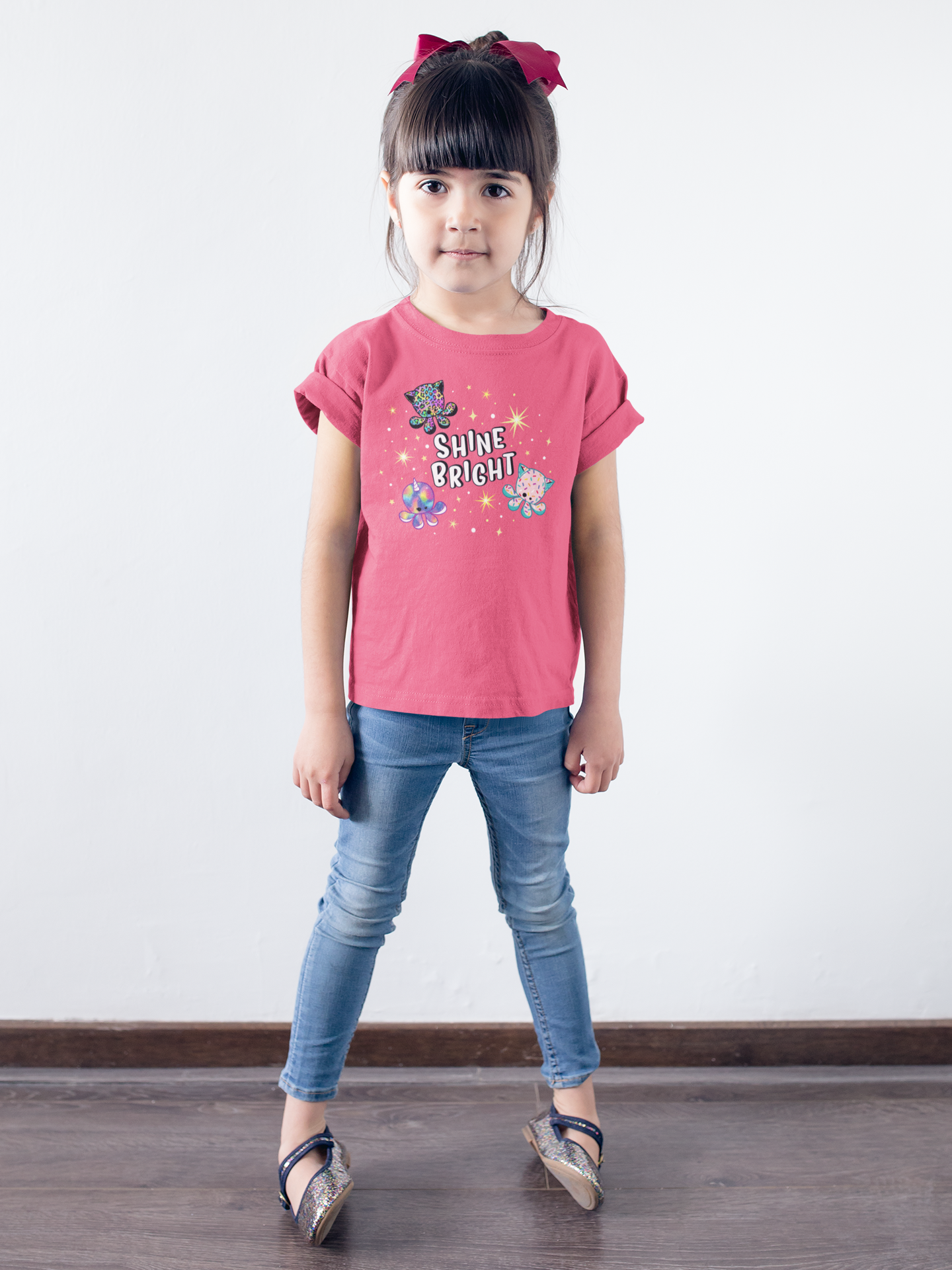little-girl-wearing-a-t-shirt-mockup-against-a-white-wall-a19465.png