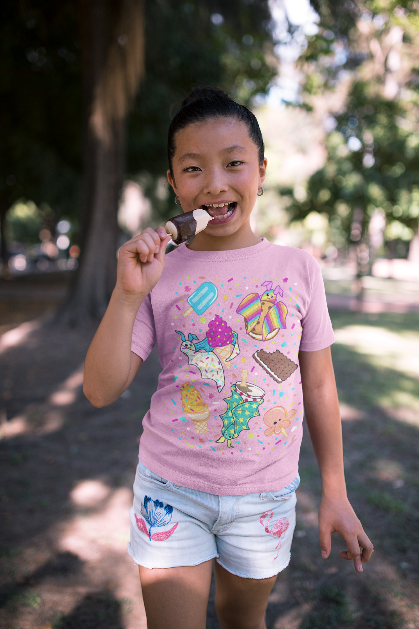 t-shirt-mockup-of-a-child-eating-a-popsicle-at-a-park-a20955.png