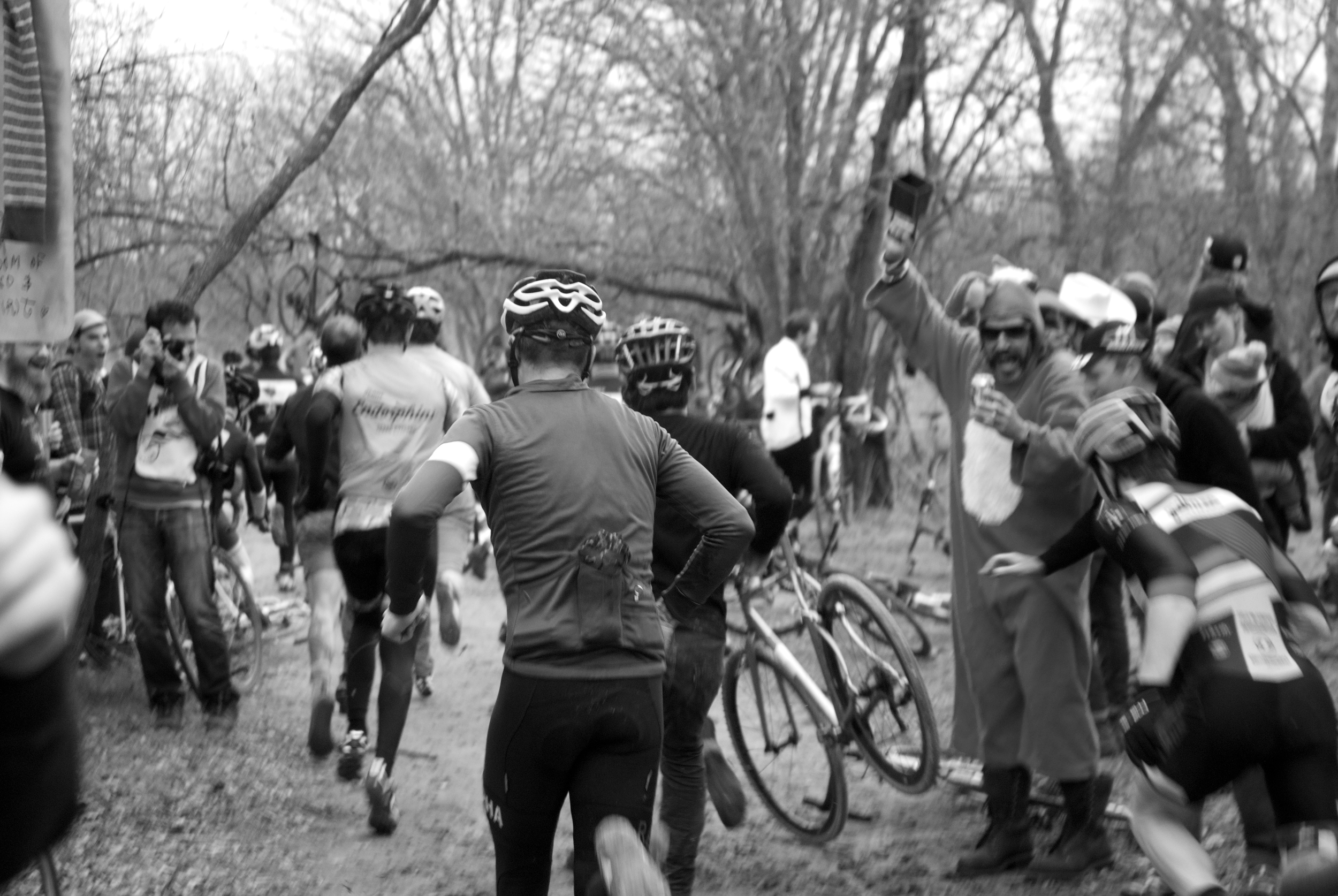 Racers run to their bikes during the Le Mans start at Crash Nationals.