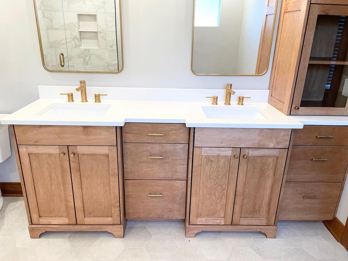 This gorgeous primary bathroom renovation involves adding modern amenities to create a luxurious experience with modern details. The centerpiece of the design is a stunning free-standing soaker tub that provides a relaxing soak after a long day. The 